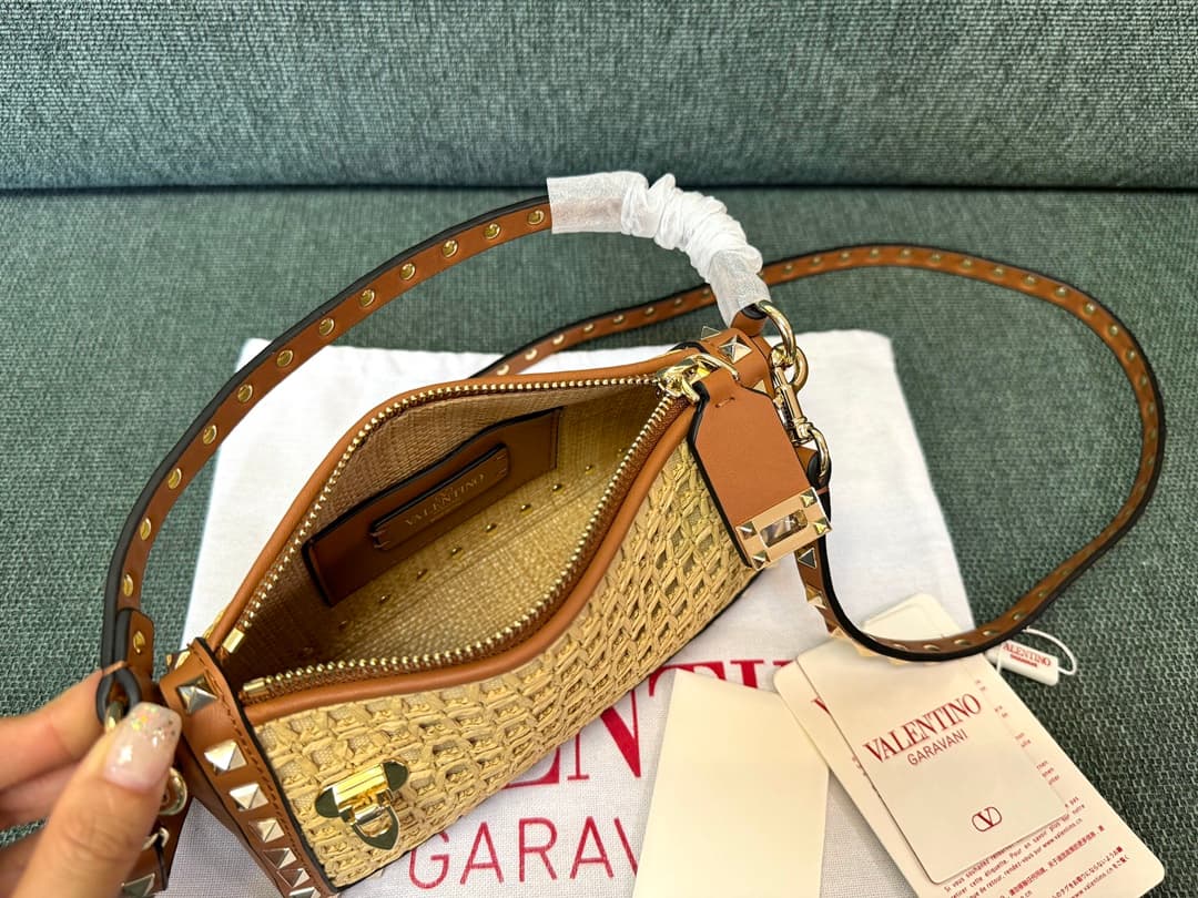 Valentino Garavani Rockstud Raffia and leather crossbody clutch High