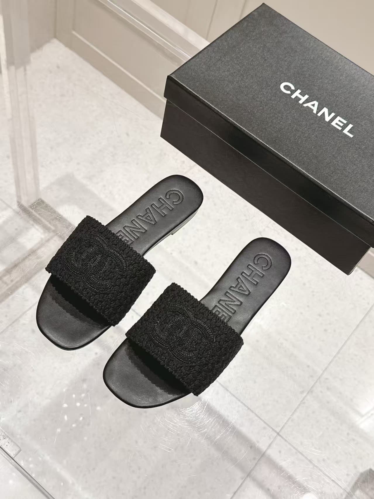 Chanel black crochet CC mules