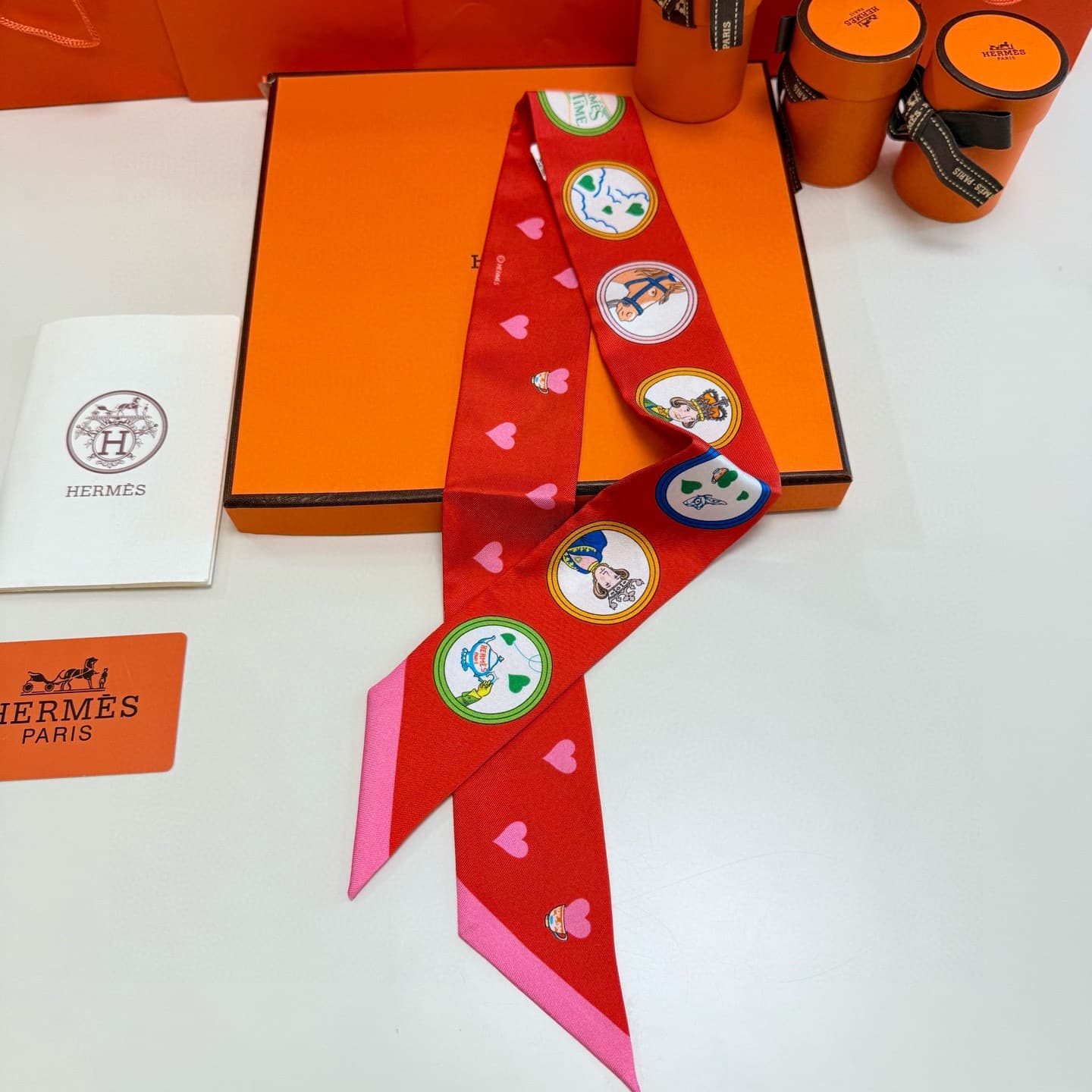 Hermes Twilly scarf featuring the 'Tea Time' motif