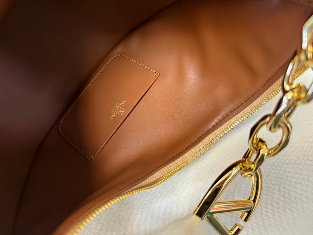 Valentino Garavani VLogo Moon small hobo bag in Gold grained calfskin High