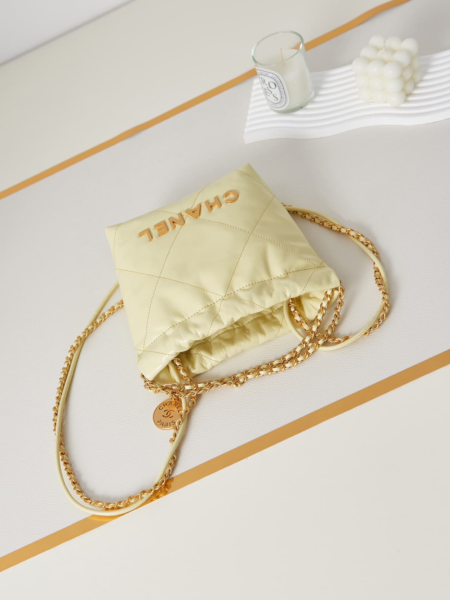 Chanel 22 MINI HANDBAG Shiny Calfskin Light Yellow & Gold-Tone Metal AS3980 A