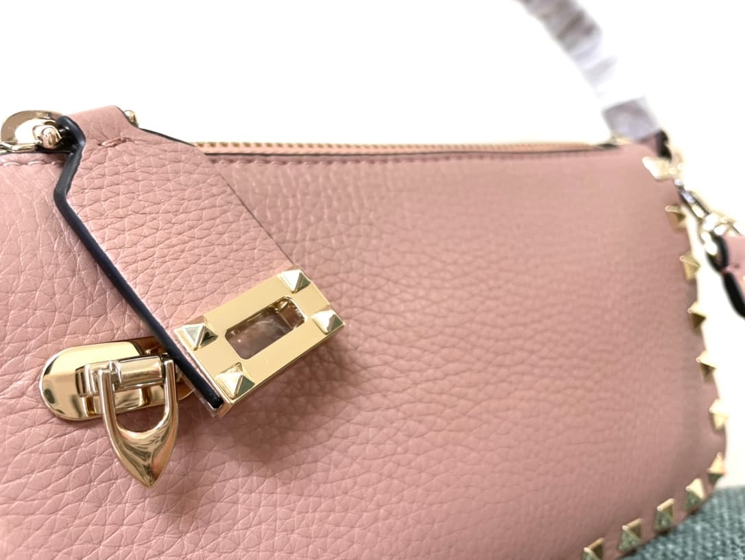 Valentino Garavani Mini Rockstud crossbody bag in powder pink Grained Calfskin High
