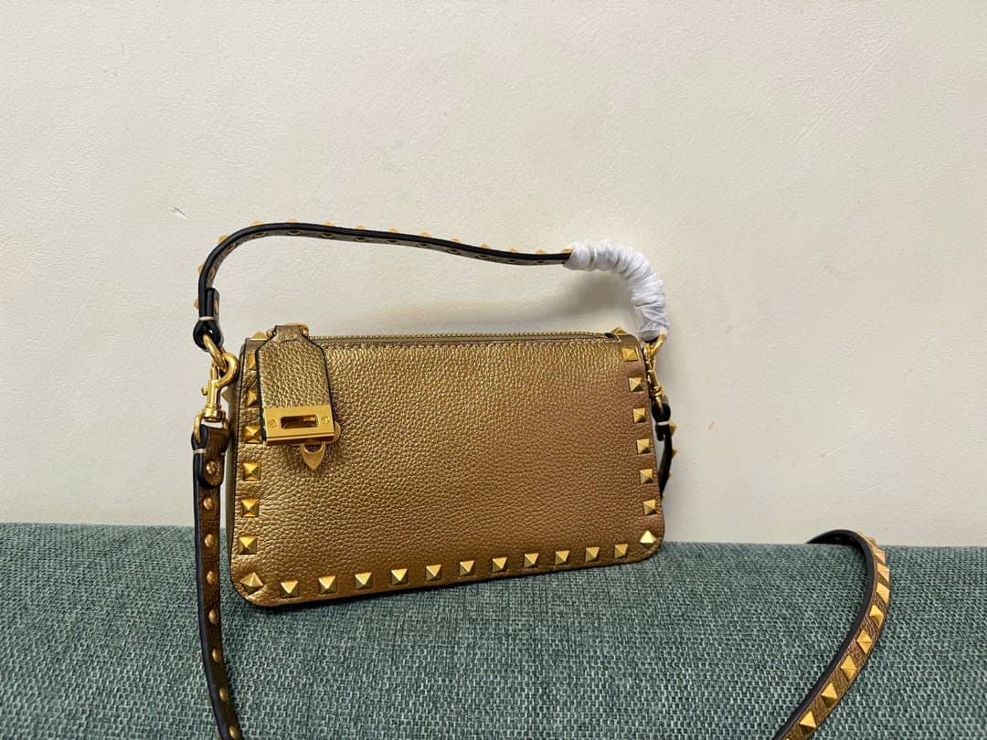 Valentino Garavani Mini Rockstud crossbody bag in Gold Grained Metallic Leather High