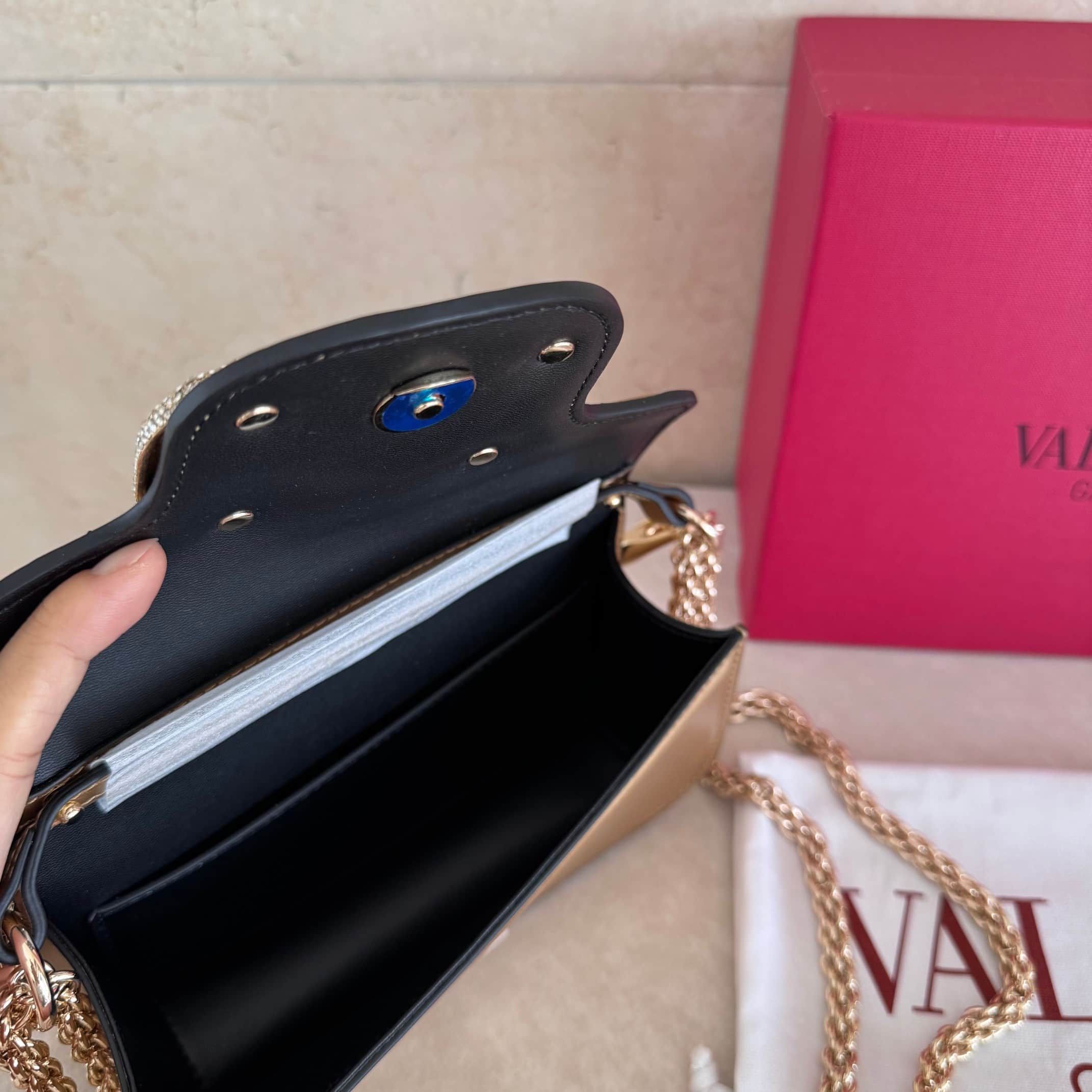 Valentino Garavani Locò Mini leather shoulder bag with crystal VLogo High