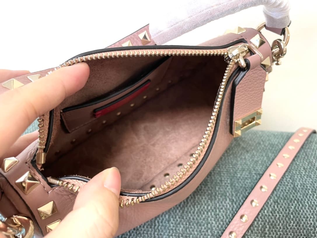 Valentino Garavani Mini Rockstud crossbody bag in powder pink Grained Calfskin High