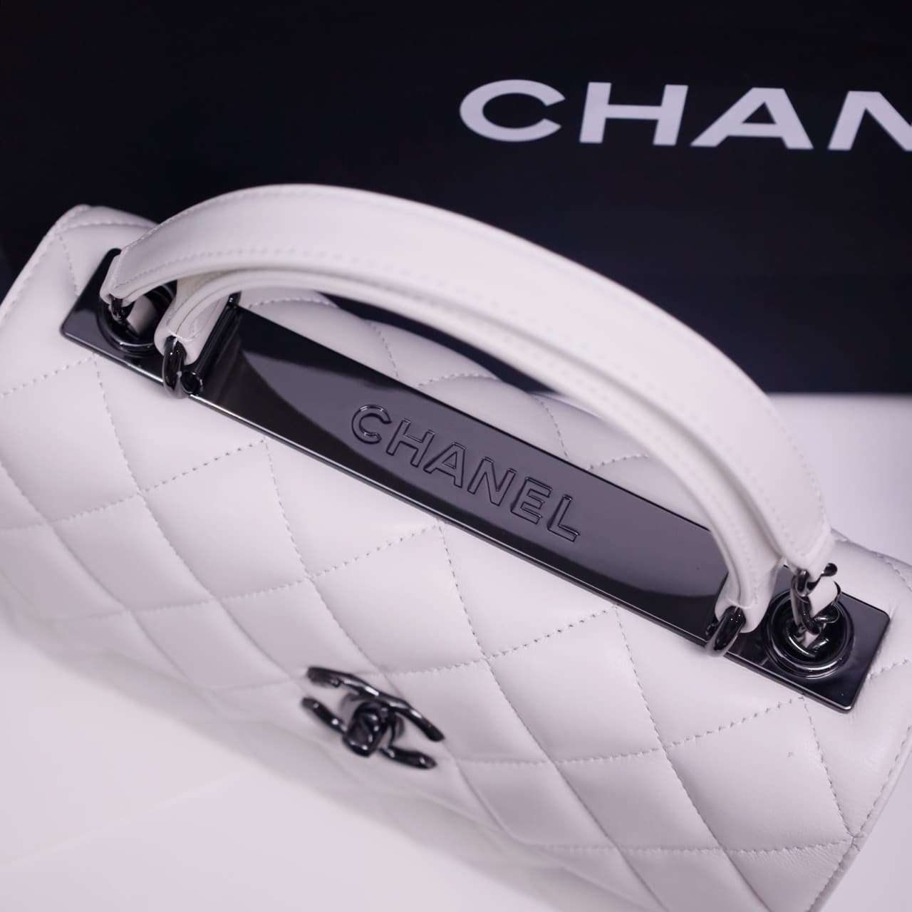 SMALL FLAP BAG WITH TOP HANDLE Lambskin Black Metal White A