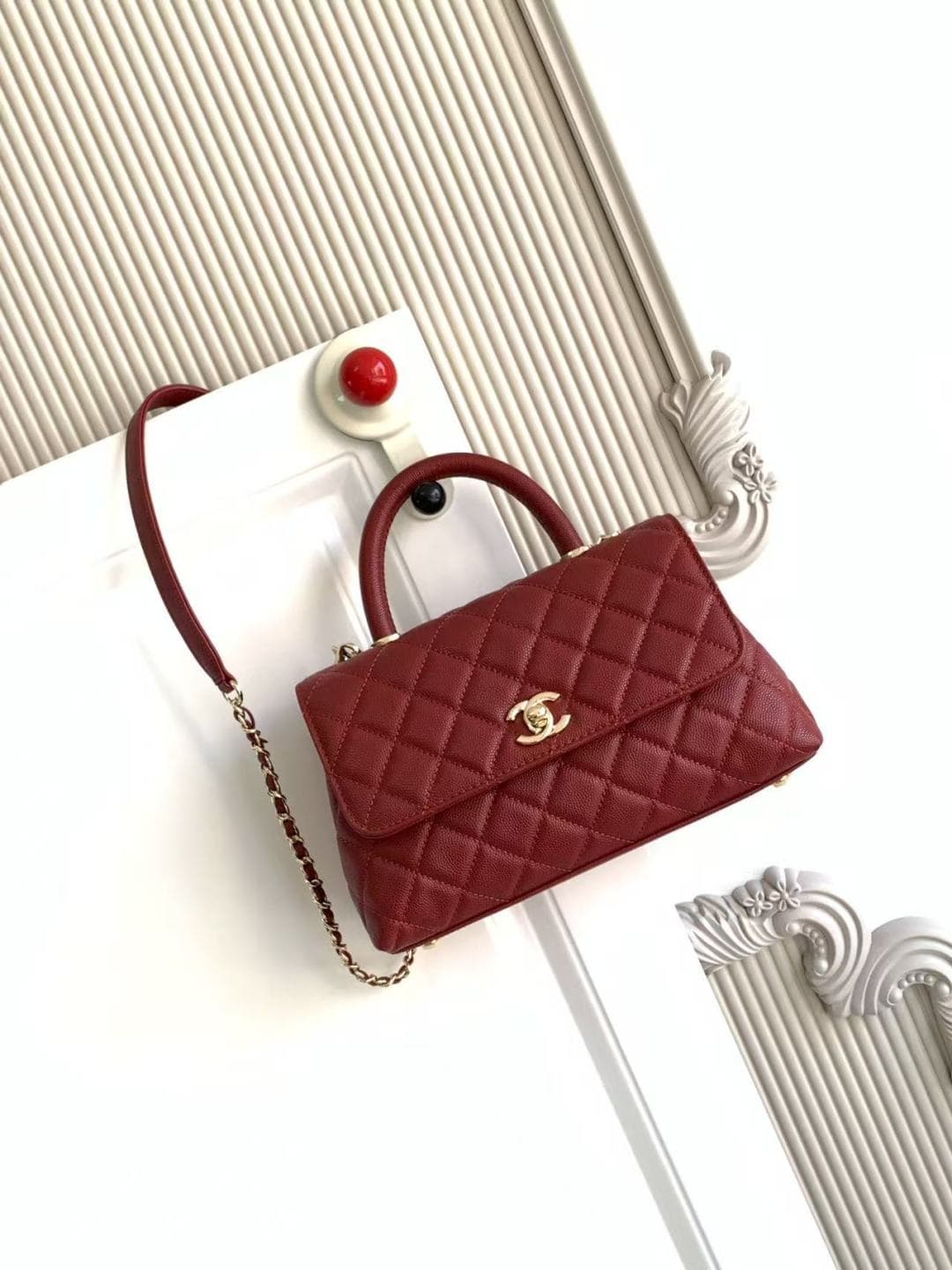 FLAP BAG WITH TOP HANDLE Grained Calfskin & Gold-Tone Metal A92990 Red Binding A