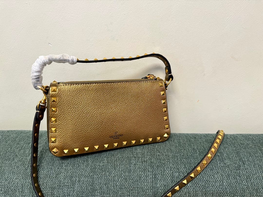 Valentino Garavani Mini Rockstud crossbody bag in Gold Grained Metallic Leather High