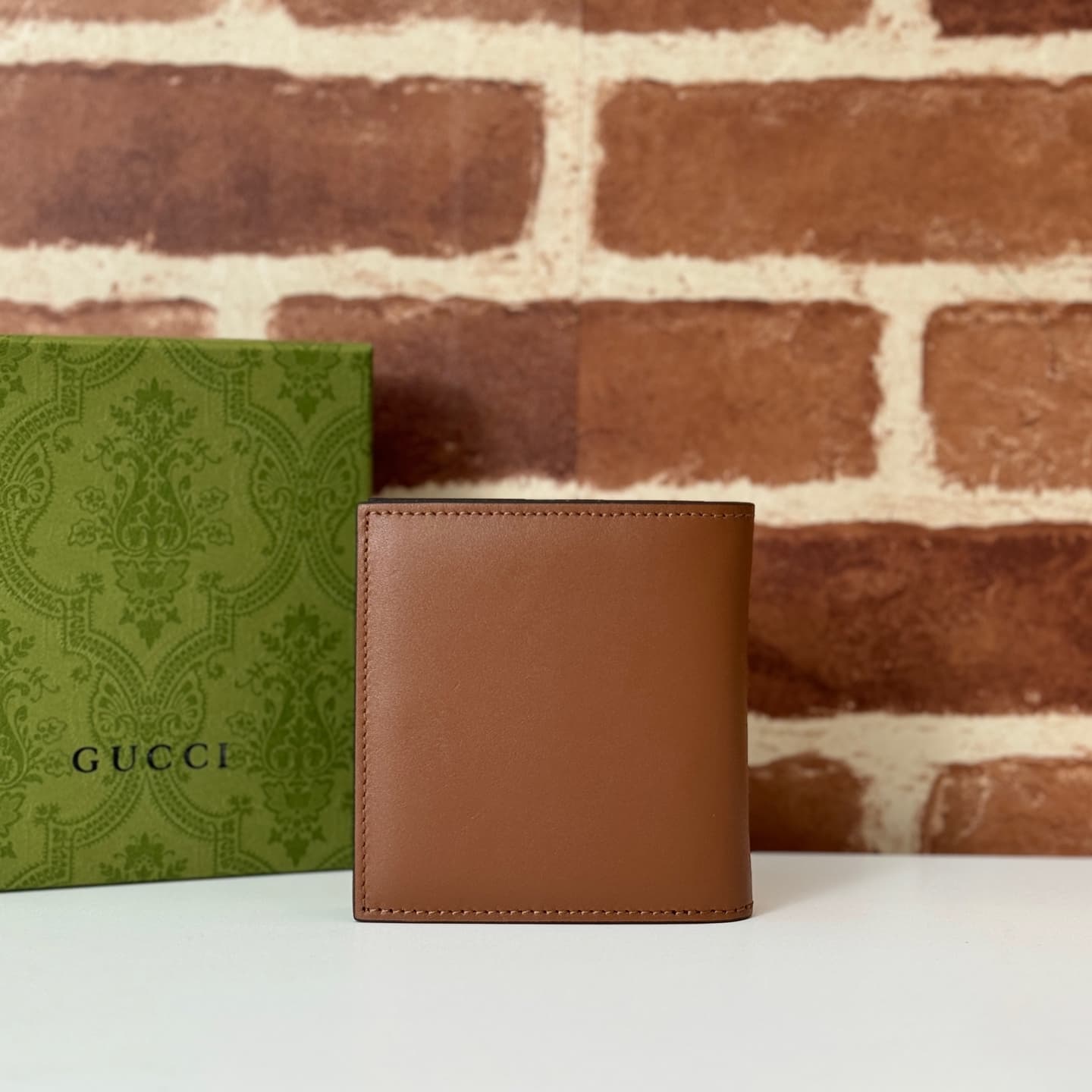 GG Emblem bi-fold wallet with GG fabric Brown smooth leather 818949  High