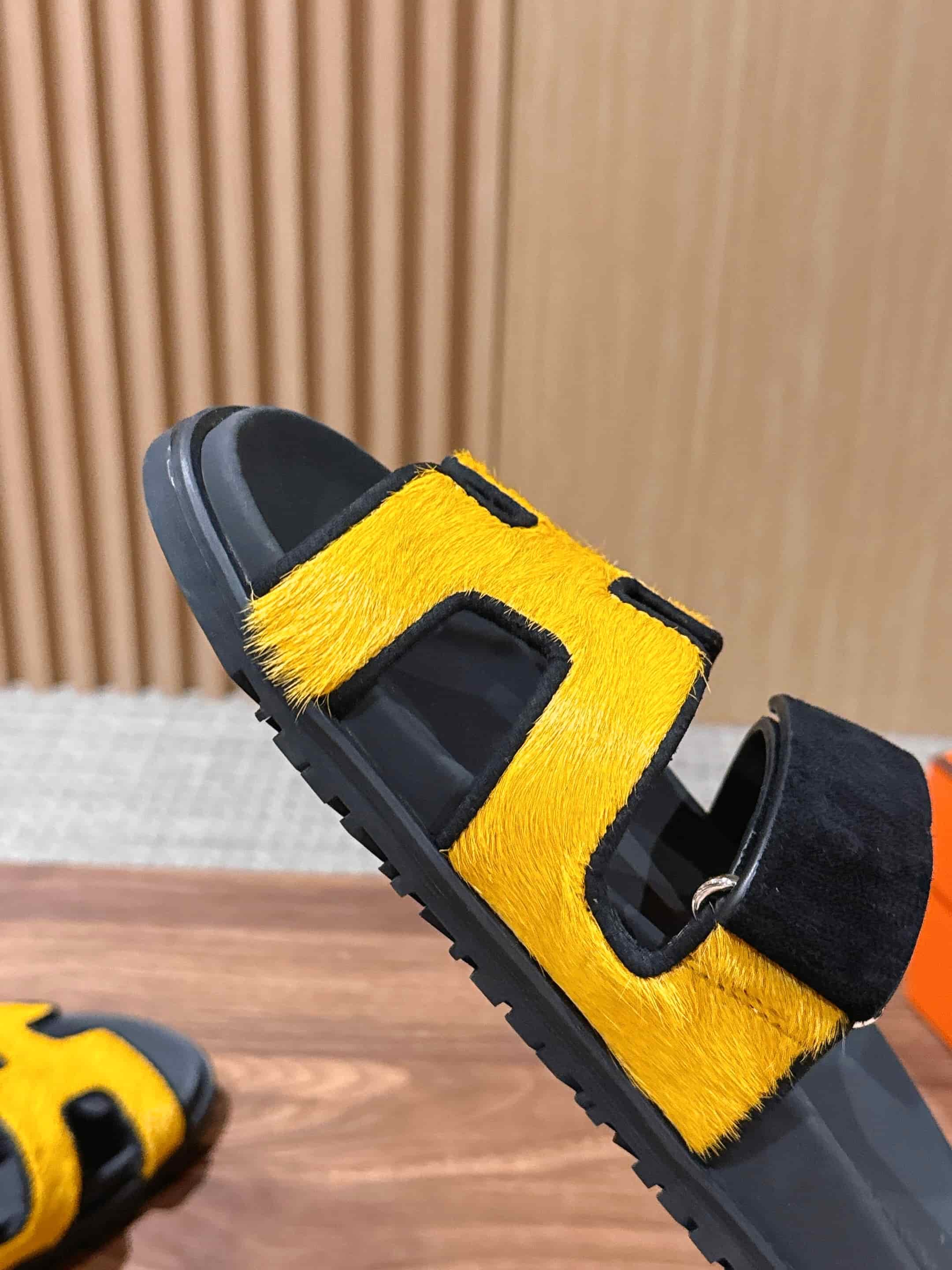 Hermès Chypre sandals in yellow suede with black accents Women Men