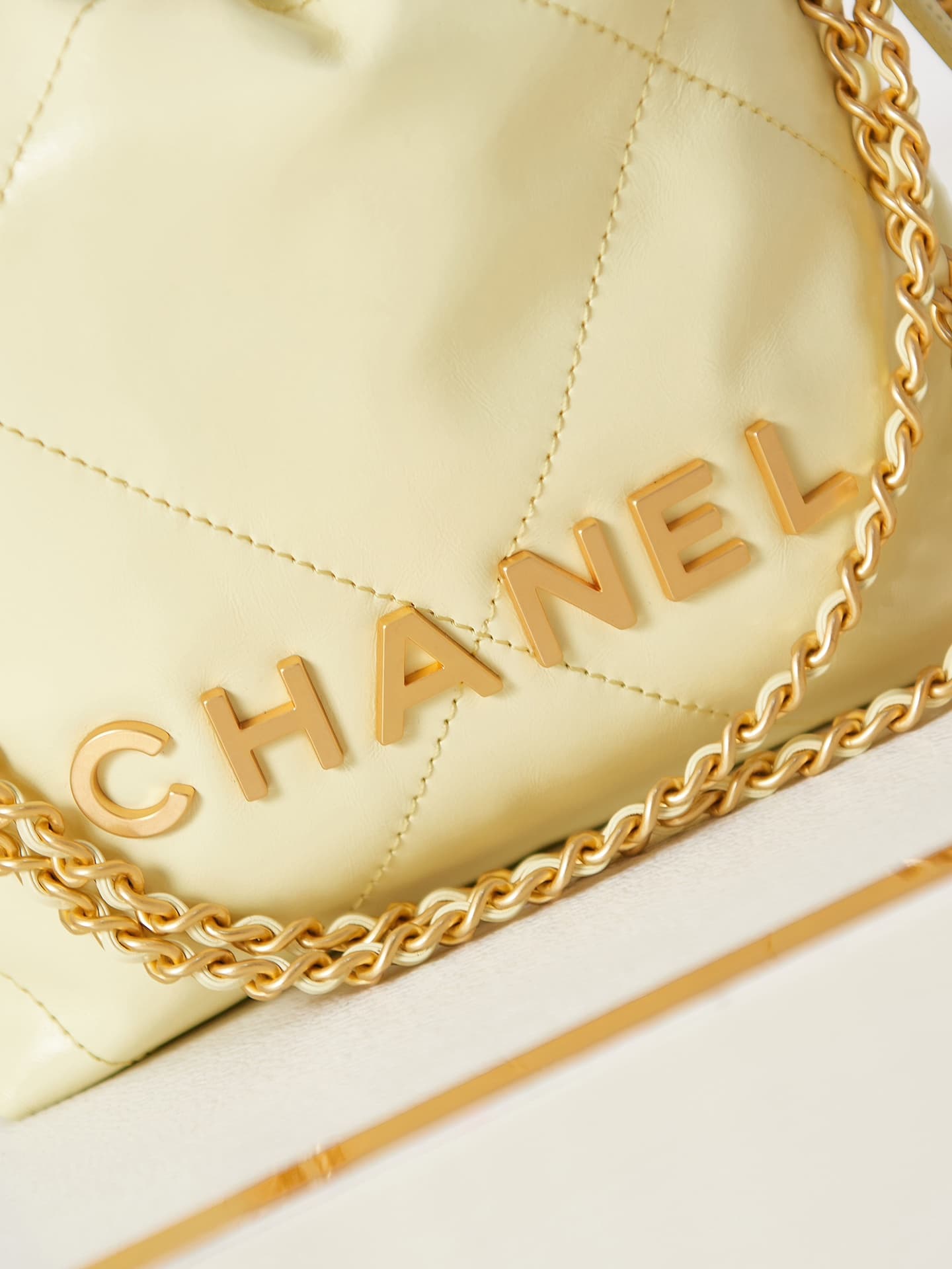 Chanel 22 MINI HANDBAG Shiny Calfskin Light Yellow & Gold-Tone Metal AS3980 A