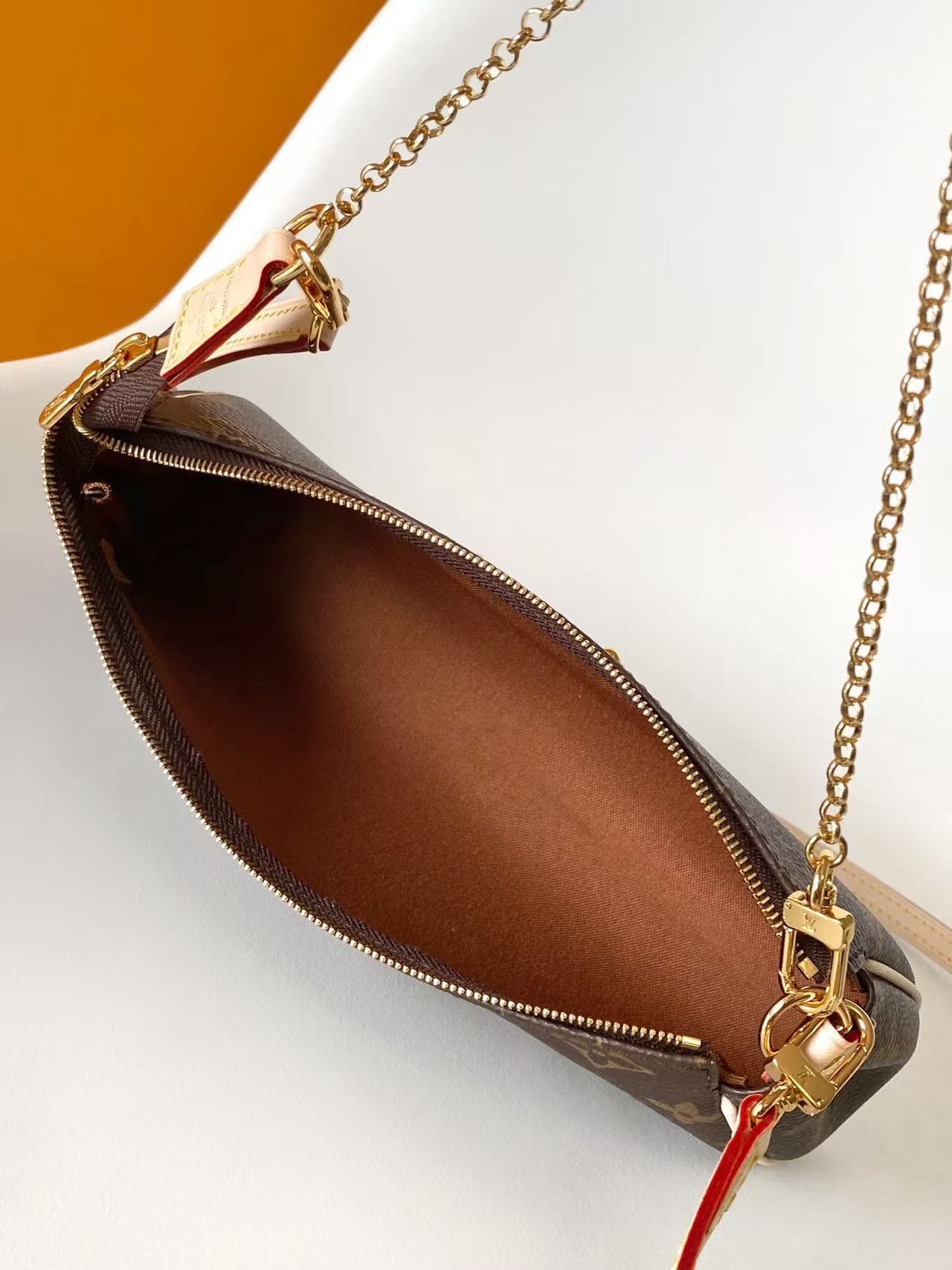 Louis Vuitton Pochette Eva Monogram coated canvas M13567 High