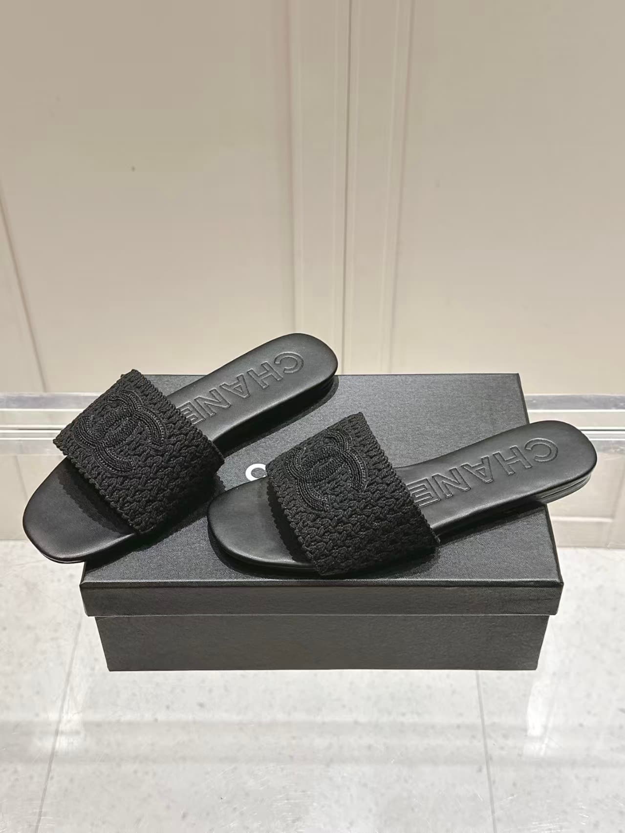 Chanel black crochet CC mules