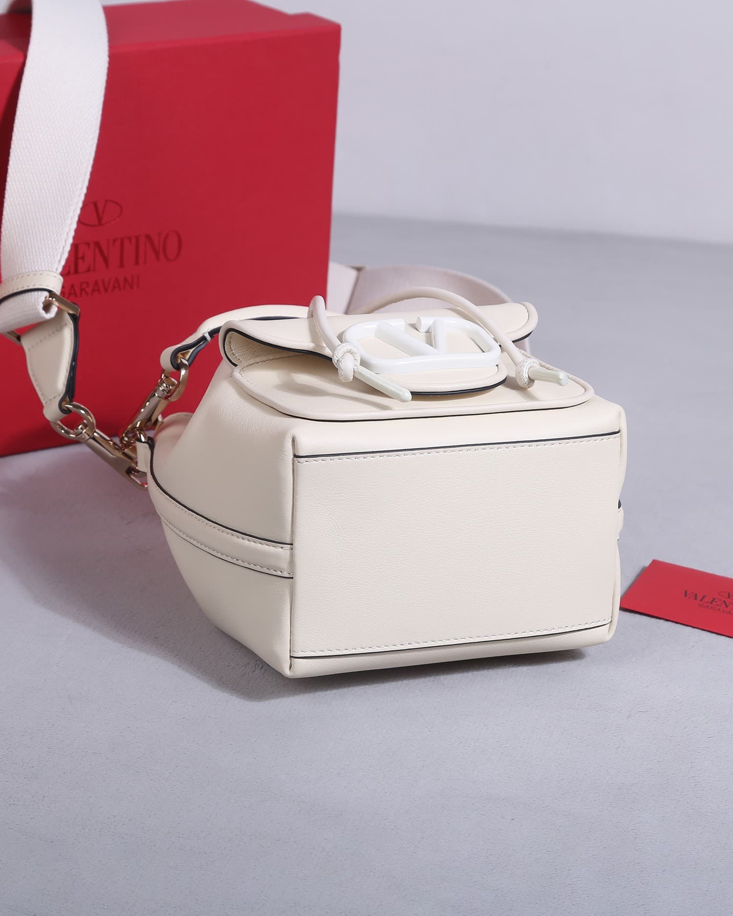 Valentino Garavani Locò calfskin leather bucket bag in white 22058 High
