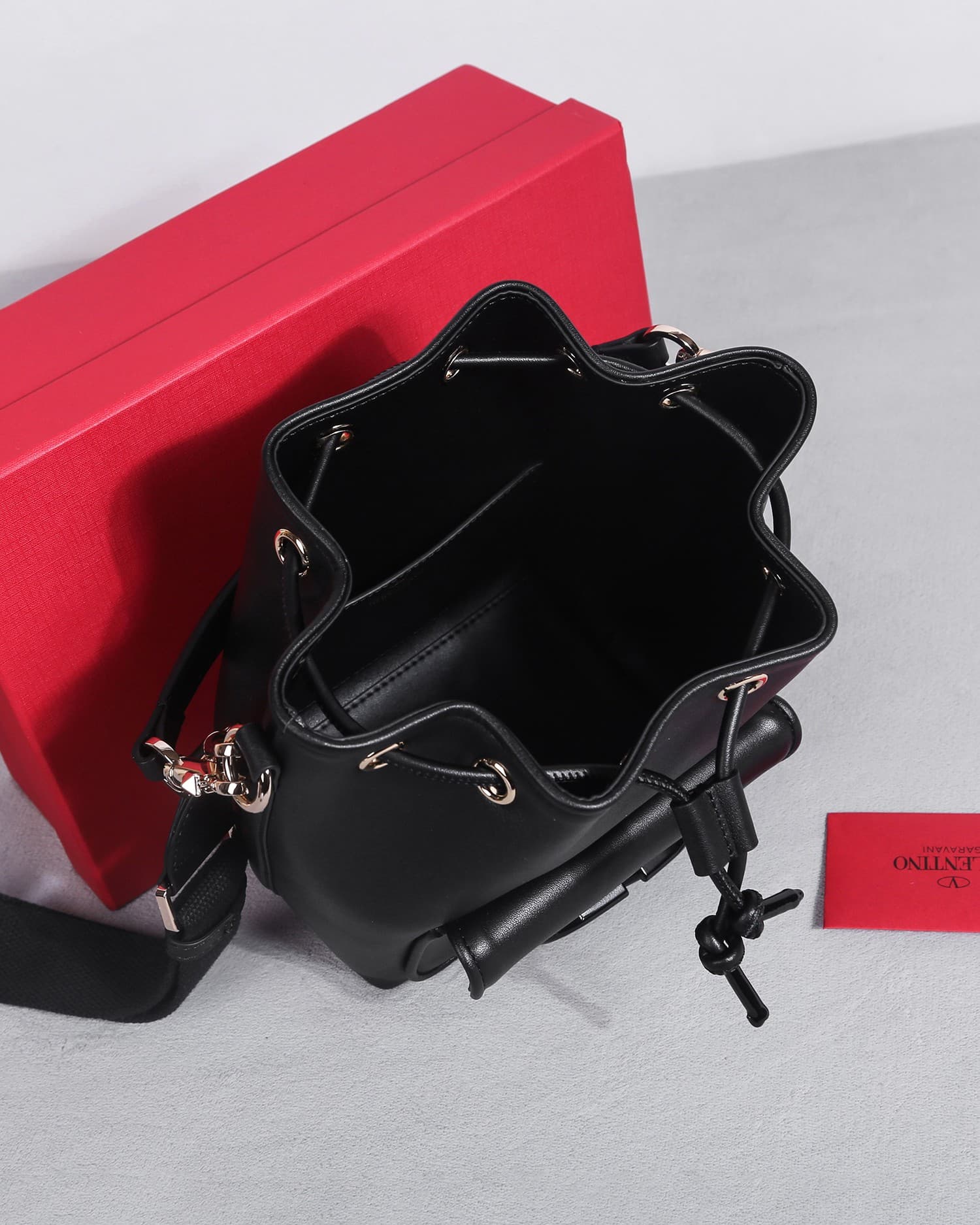 Valentino Garavani Locò calfskin leather bucket bag in black 22058 High