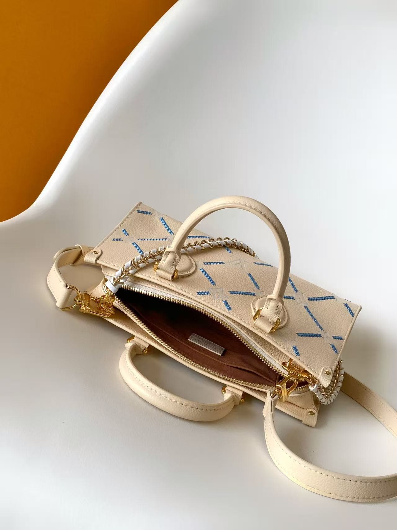 Louis Vuitton Onthego East West Light Bliss Couture Cowhide leather M29487 High