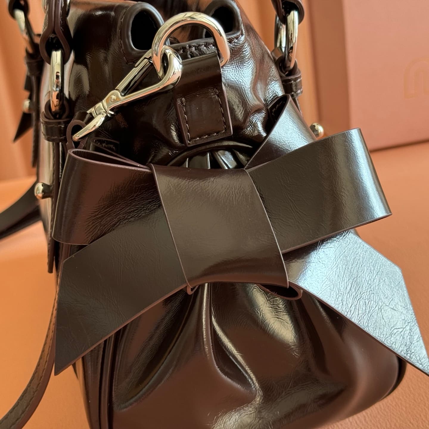 Miu Miu Shiny leather top-handle bag Briarwood Calfskin 5BA327 TOP