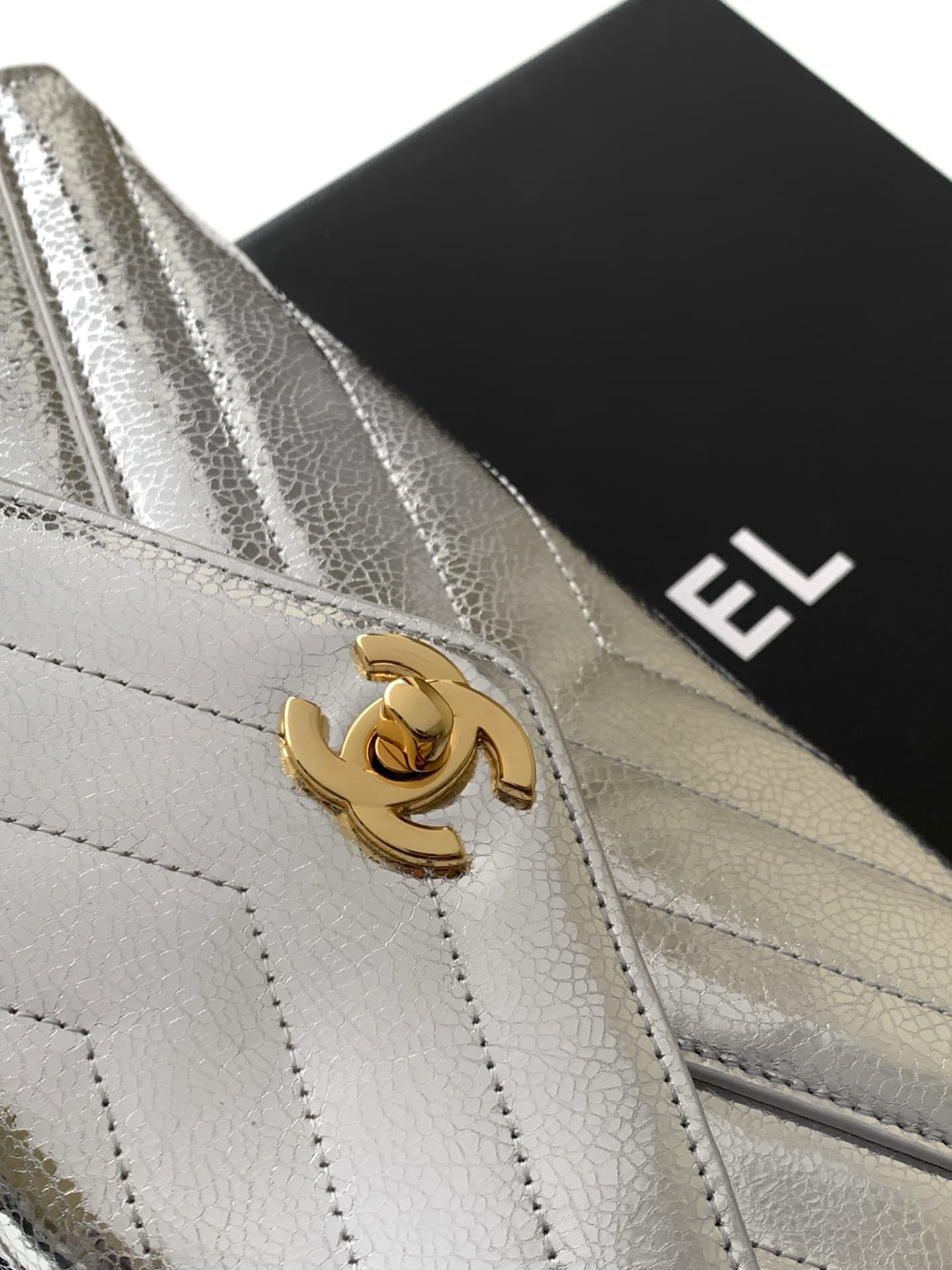 Chanel Flap Bag with Top Handle Metallic Chevron Calfskin Leather Finish& Gold-Tone Metal Silver AS6044 A