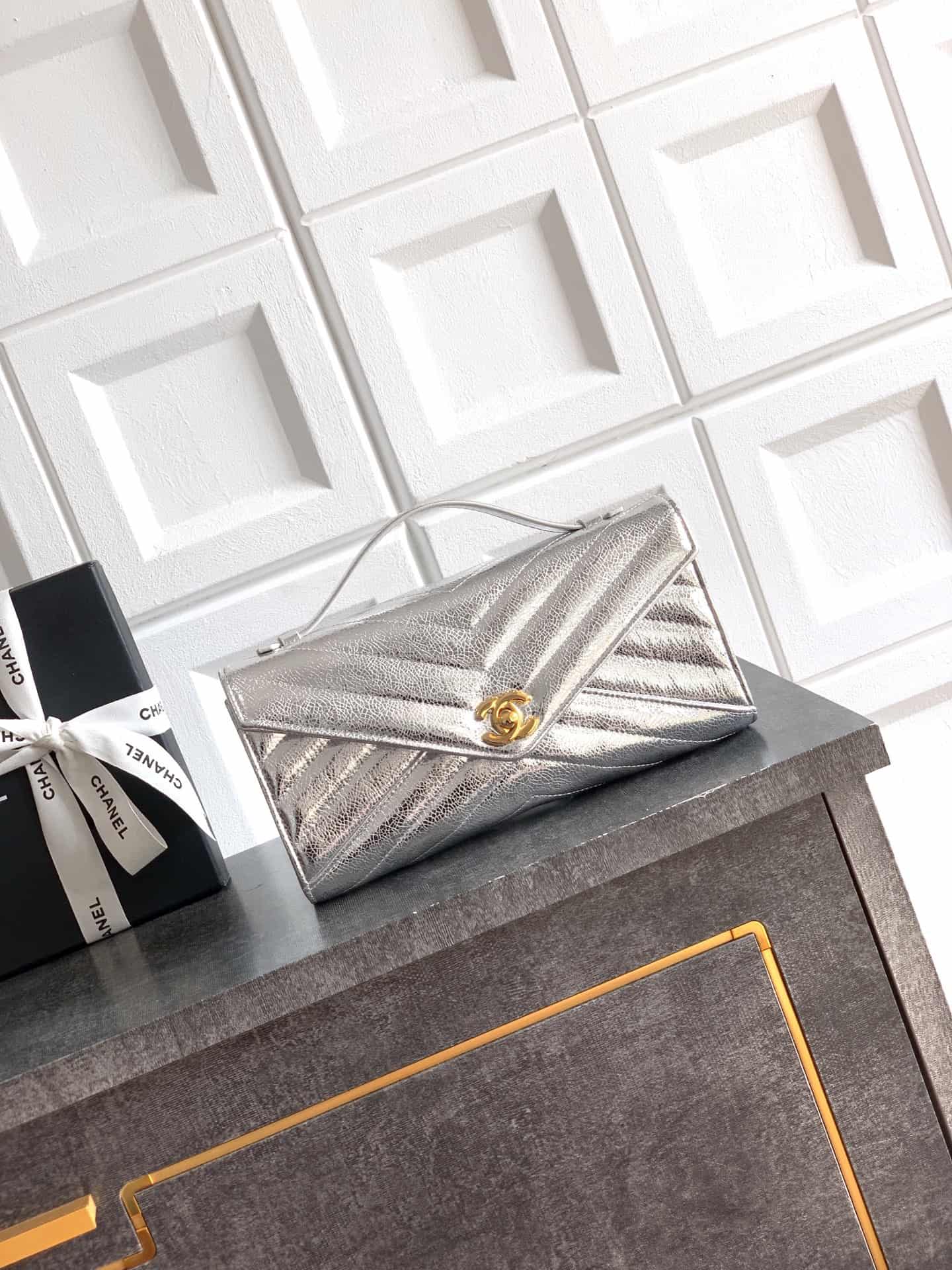 Chanel Flap Bag with Top Handle Metallic Chevron Lambskin Leather Finish& Gold-Tone Metal Silver AS6044 A