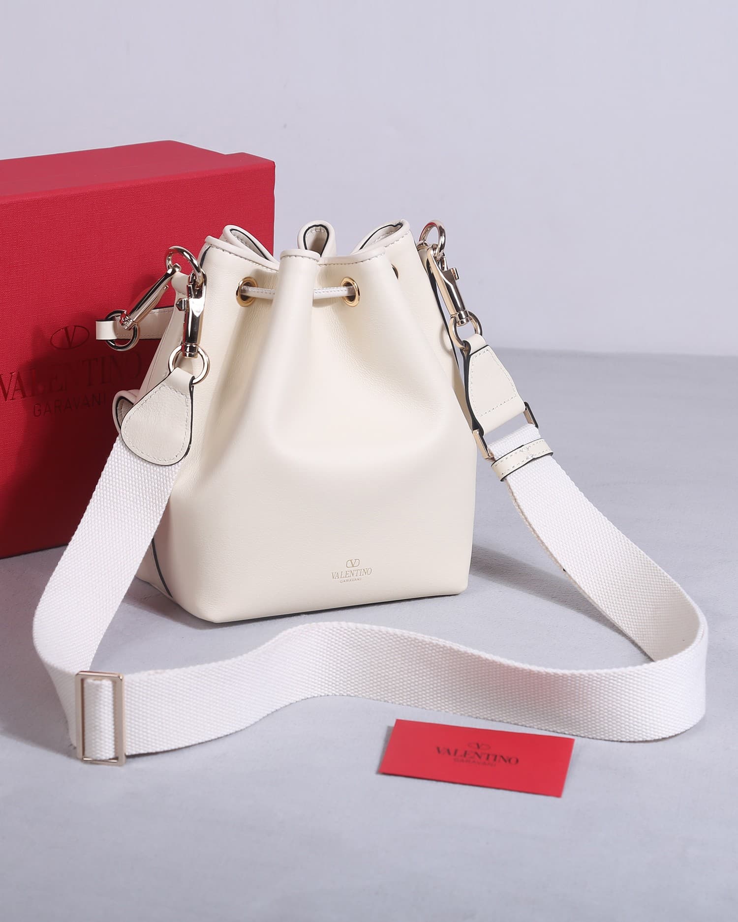 Valentino Garavani Locò calfskin leather bucket bag in white 22058 High