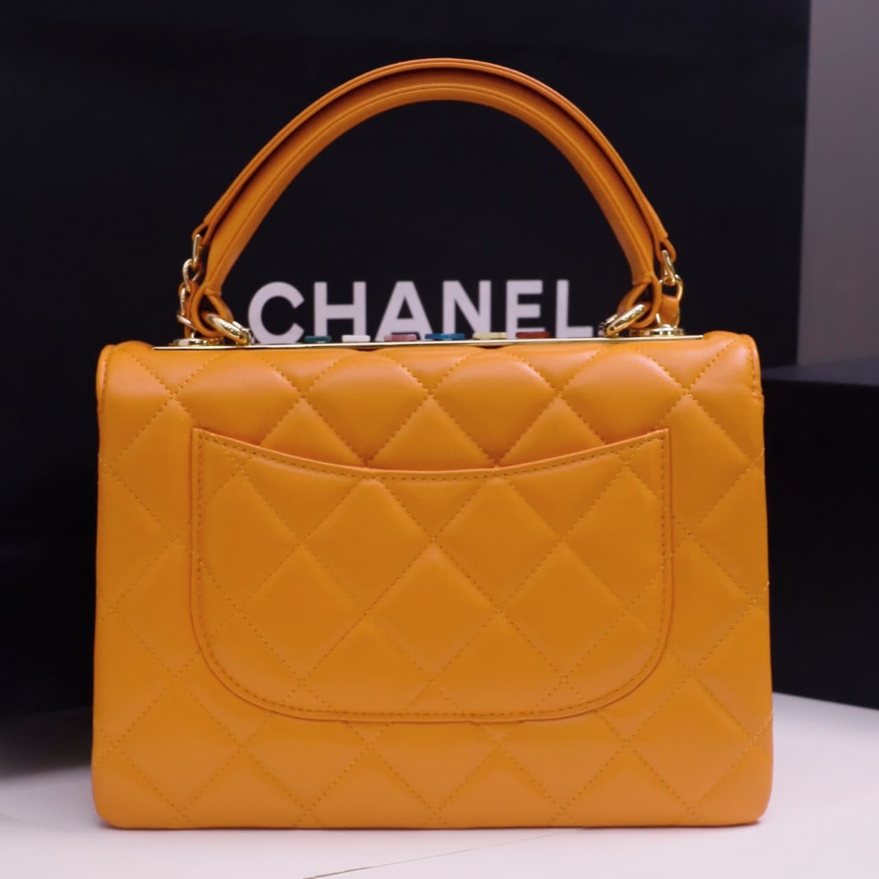 SMALL FLAP BAG WITH TOP HANDLE Lambskin Gold Metal Orange A