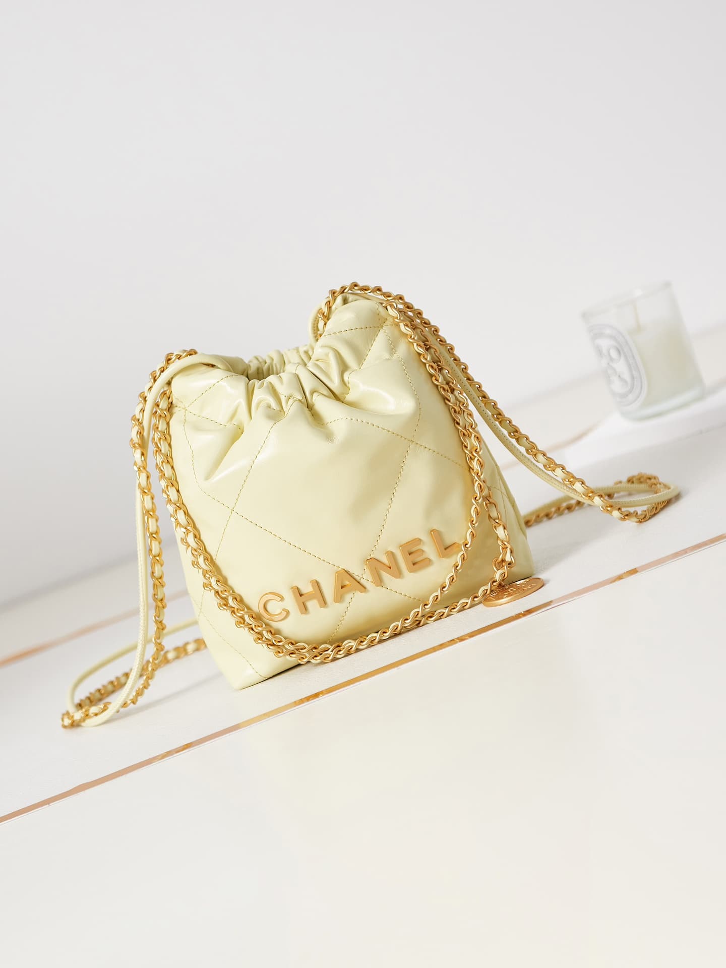 Chanel 22 MINI HANDBAG Shiny Calfskin Light Yellow & Gold-Tone Metal AS3980 A