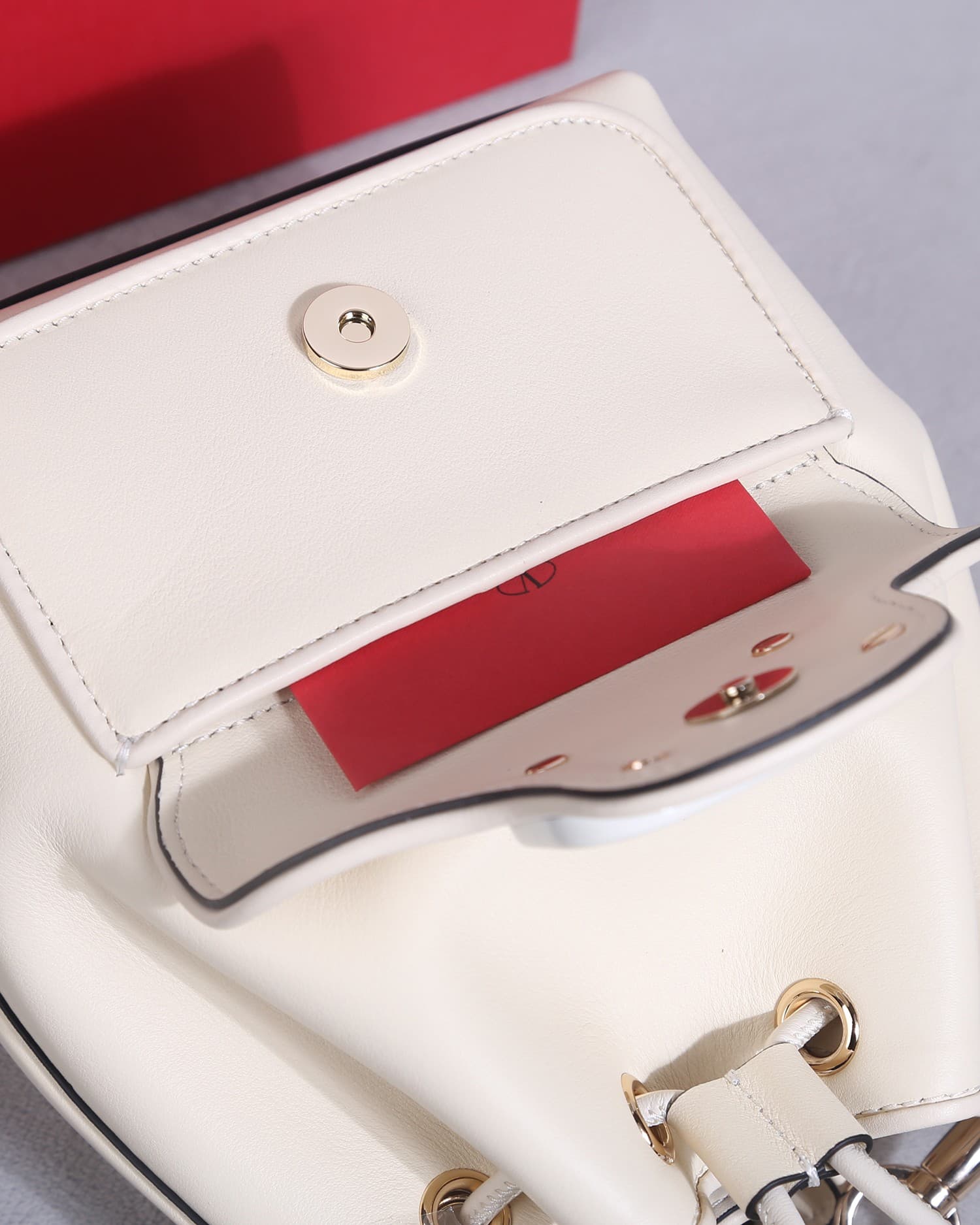 Valentino Garavani Locò calfskin leather bucket bag in white 22058 High