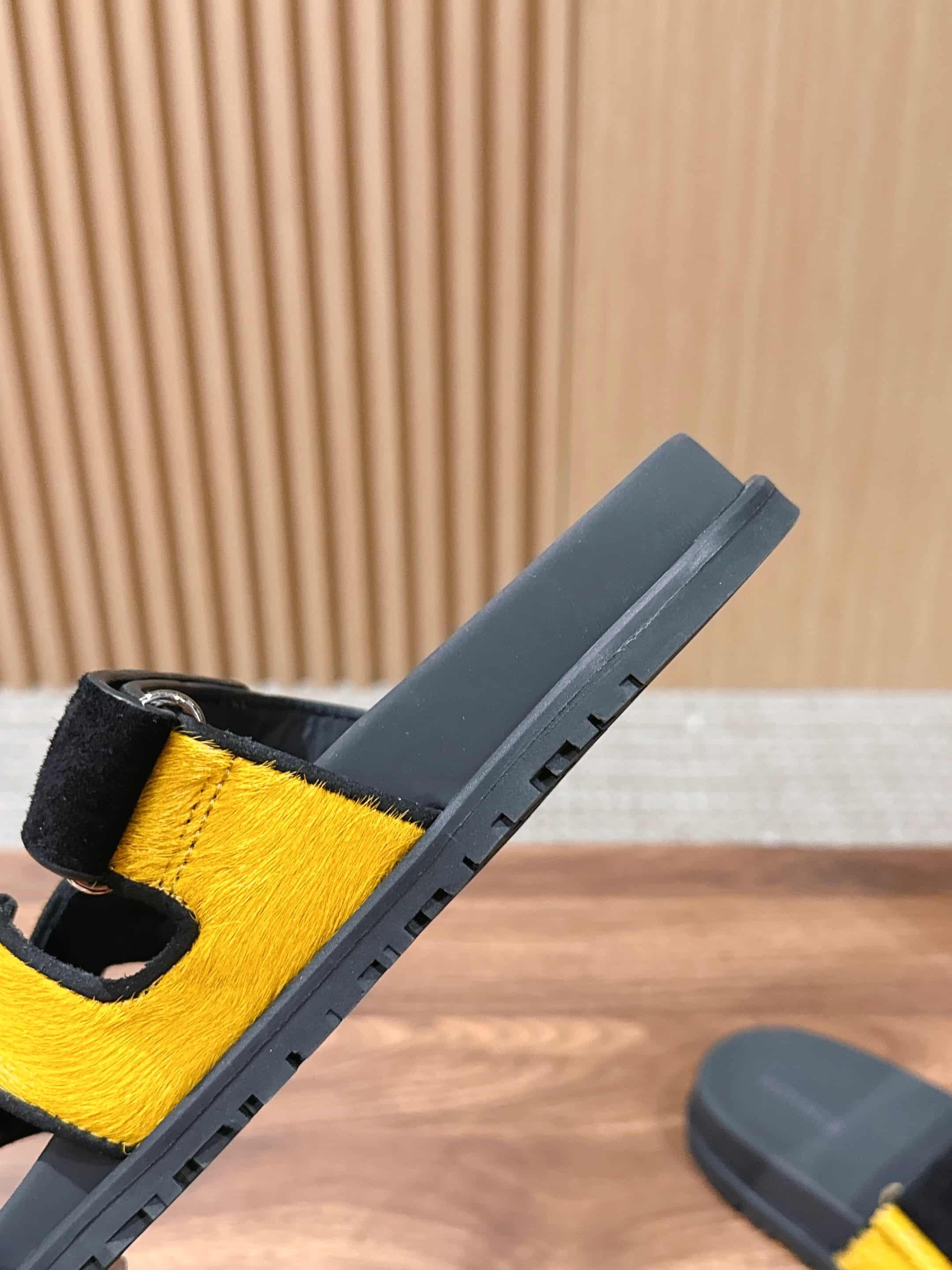 Hermès Chypre sandals in yellow suede with black accents Women Men