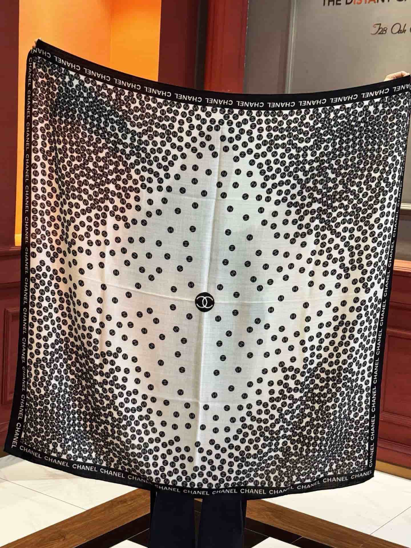 Chanel silk scarf featuring polka dot pattern