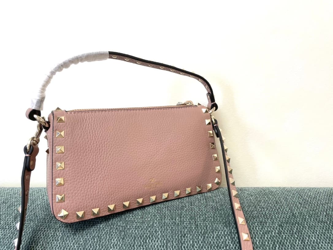 Valentino Garavani Mini Rockstud crossbody bag in powder pink Grained Calfskin High