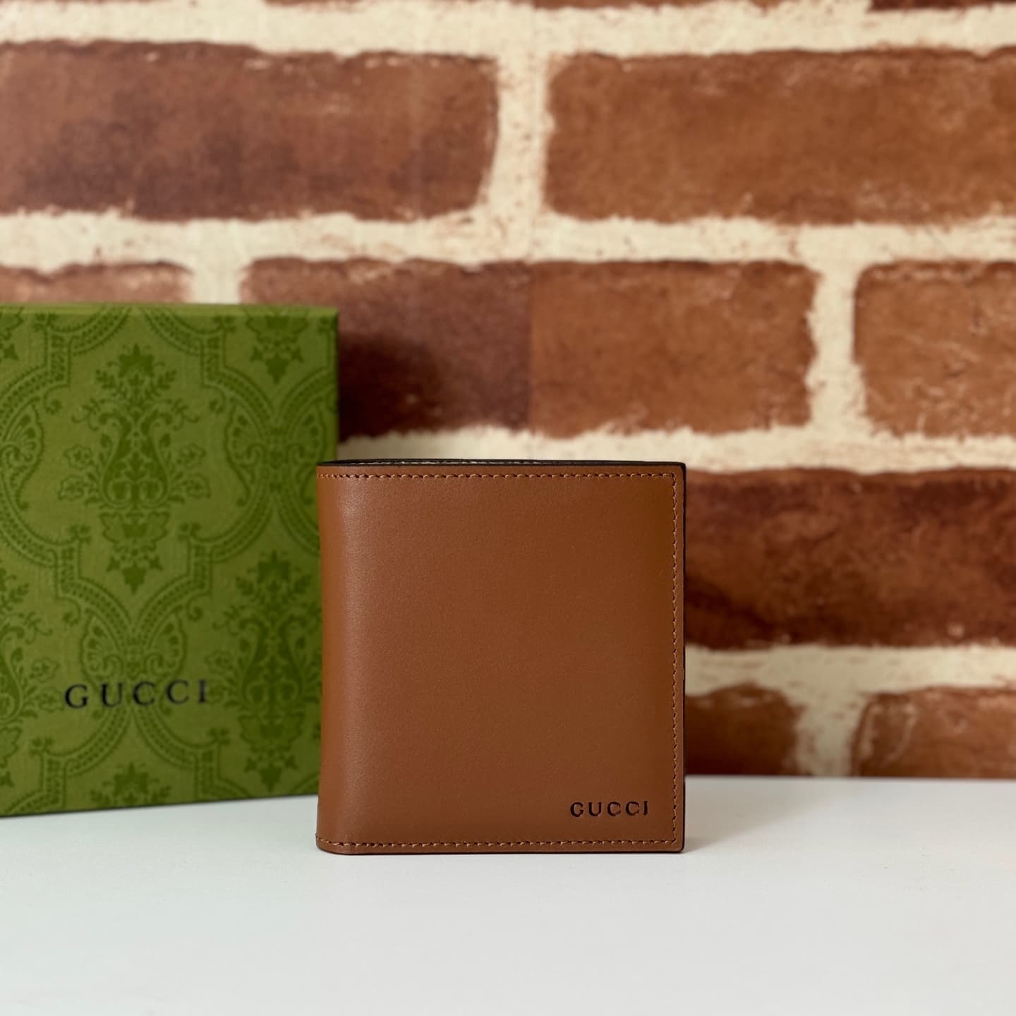 GG Emblem bi-fold wallet with GG fabric Brown smooth leather 818949  High