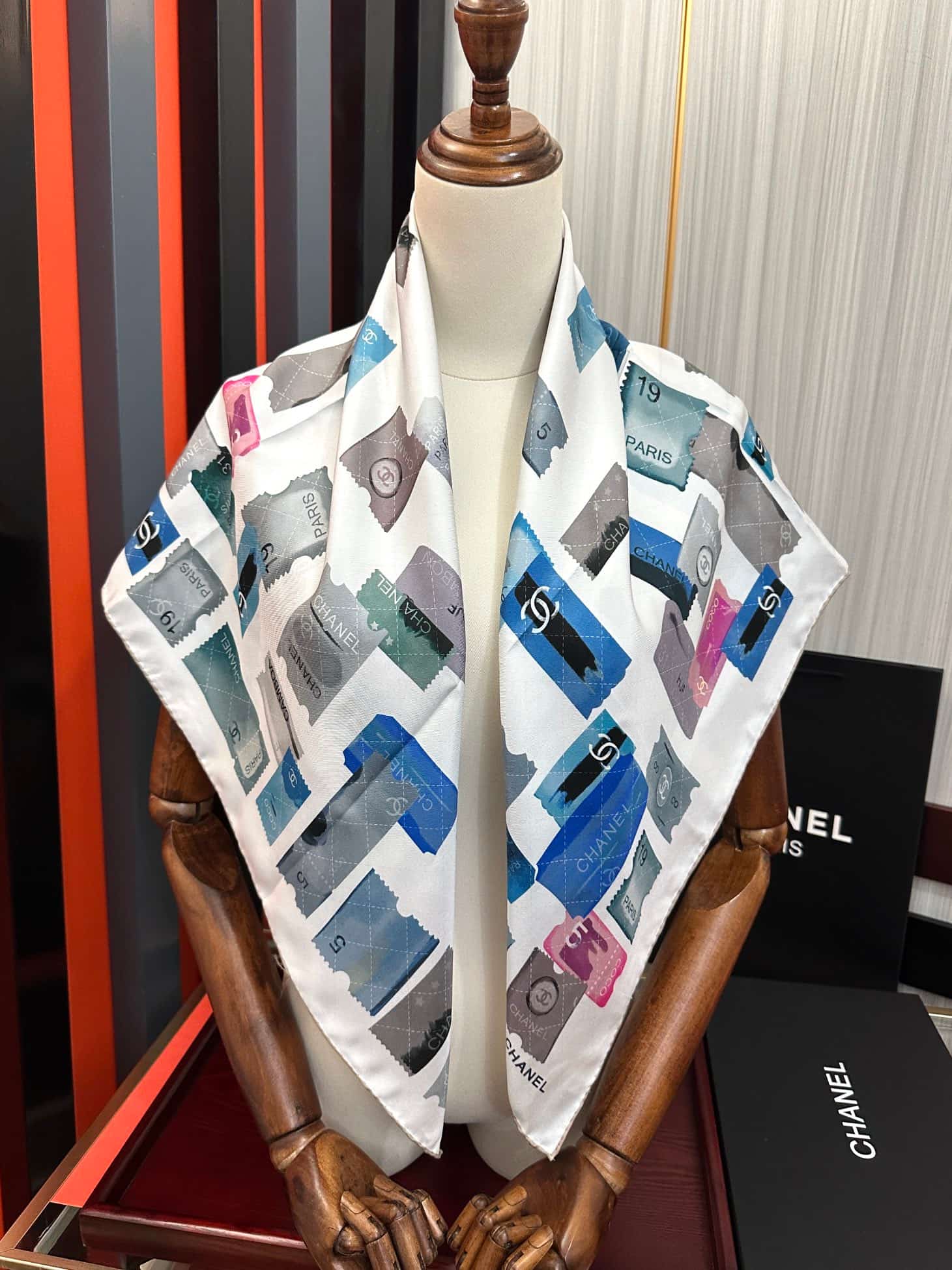 Chanel silk scarf featuring blue and pink stamp print