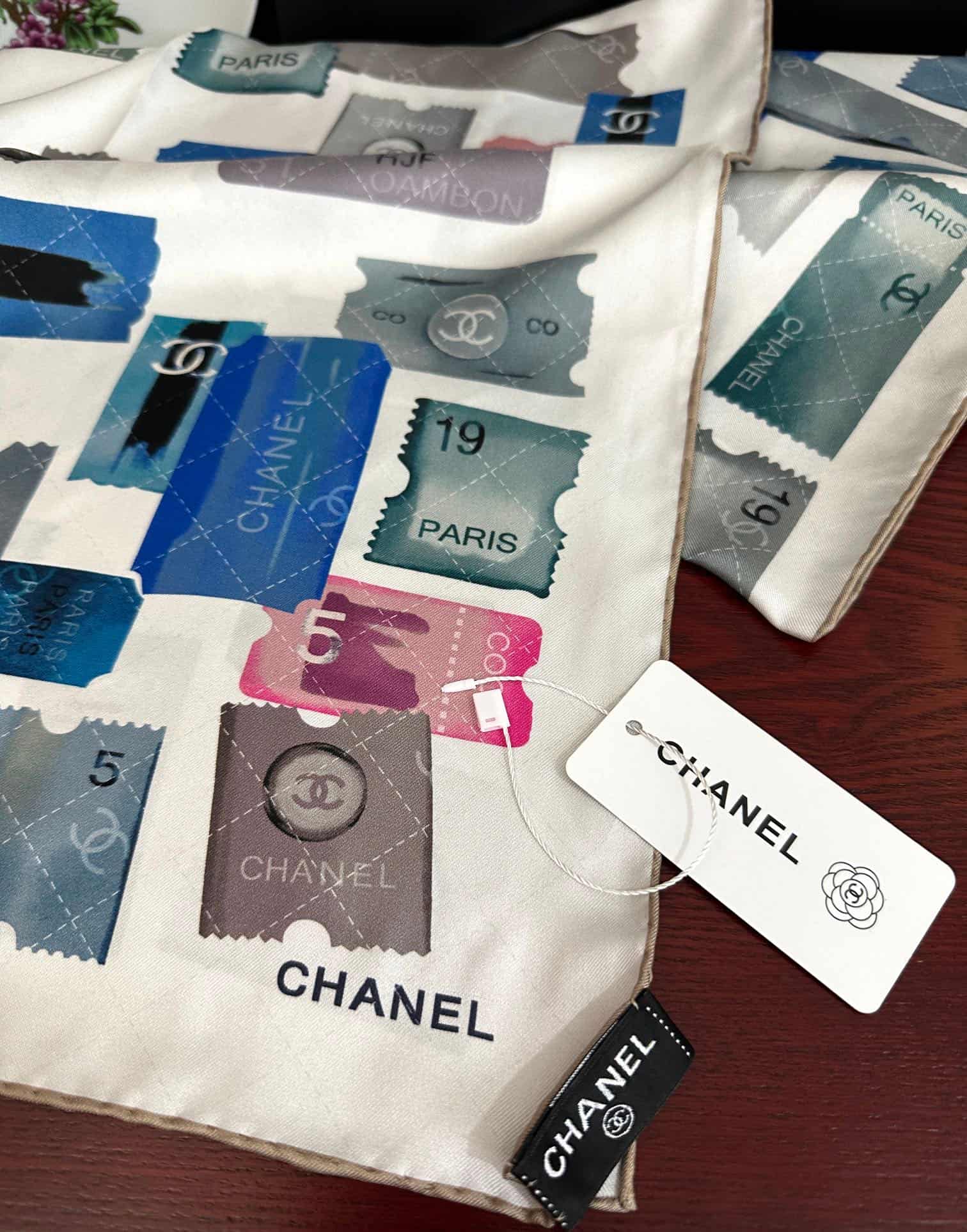 Chanel silk scarf featuring blue and pink stamp print