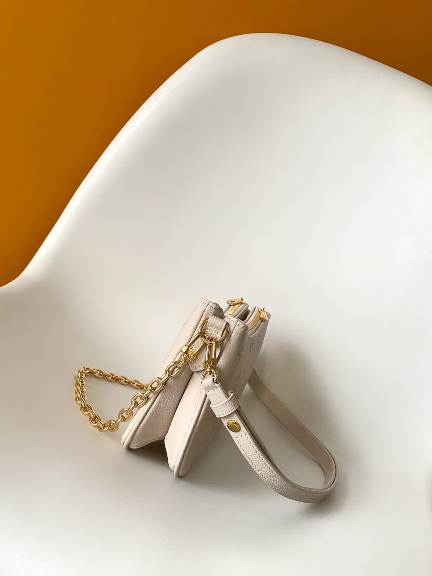Louis Vuitton Pochette Liv Milky White/Peach Embossed grained cowhide leather M27741 High