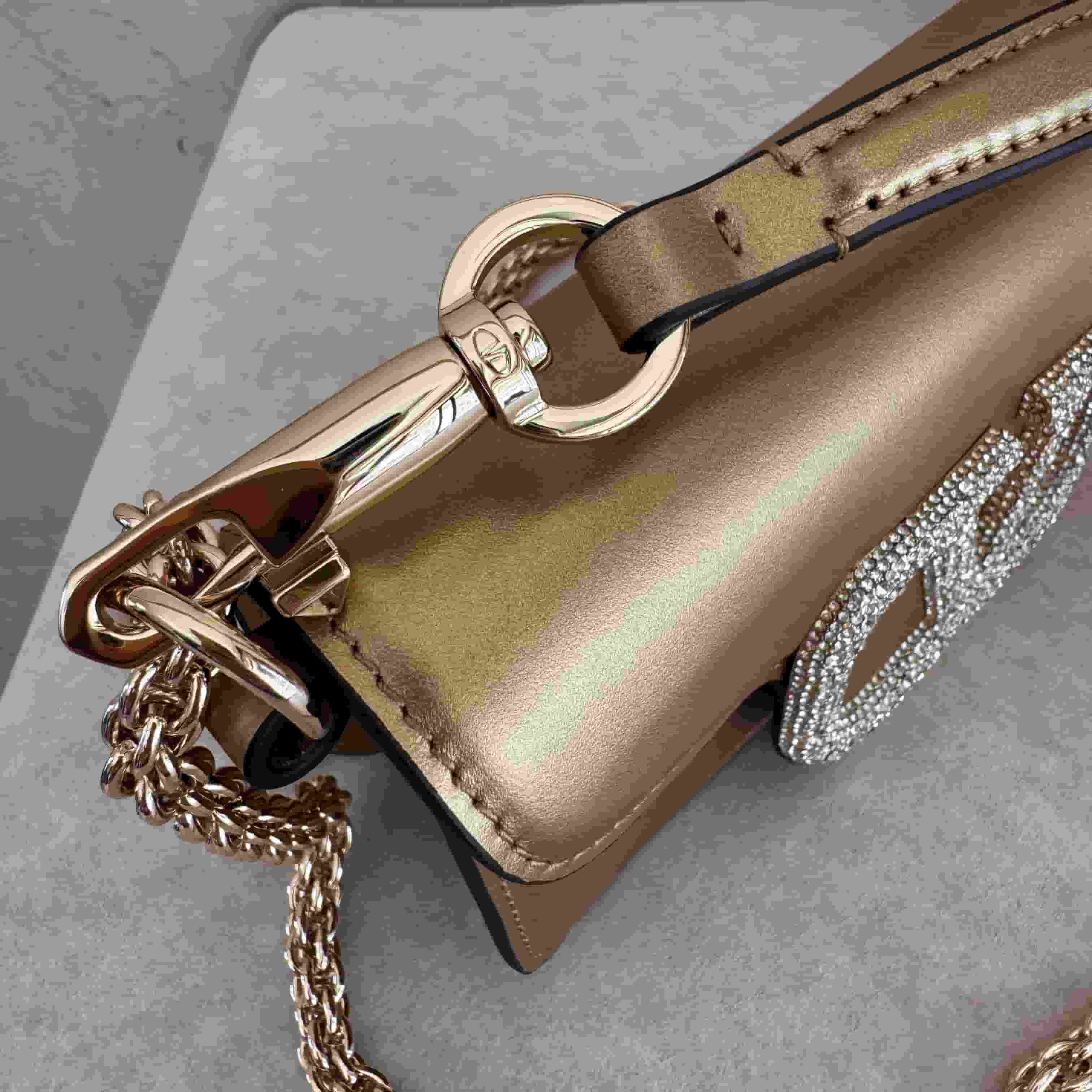 Valentino Garavani Locò Mini leather shoulder bag with crystal VLogo High