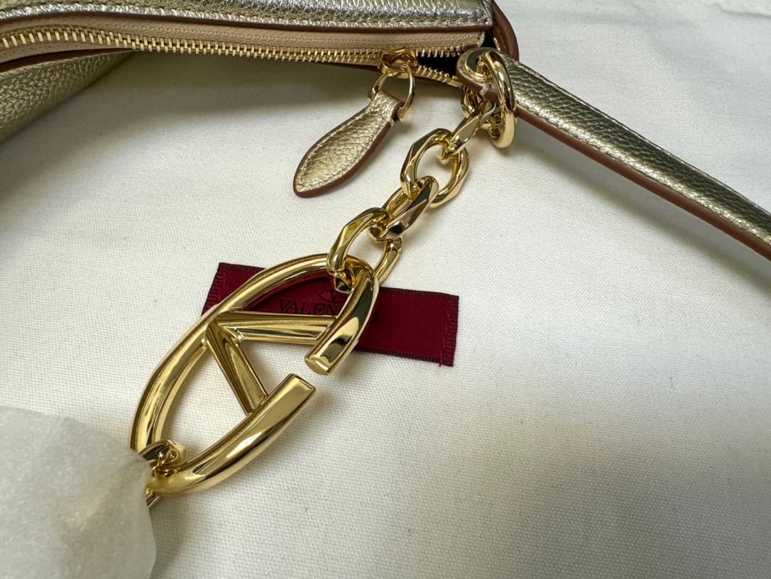 Valentino Garavani VLogo Moon small hobo bag in Gold grained calfskin High
