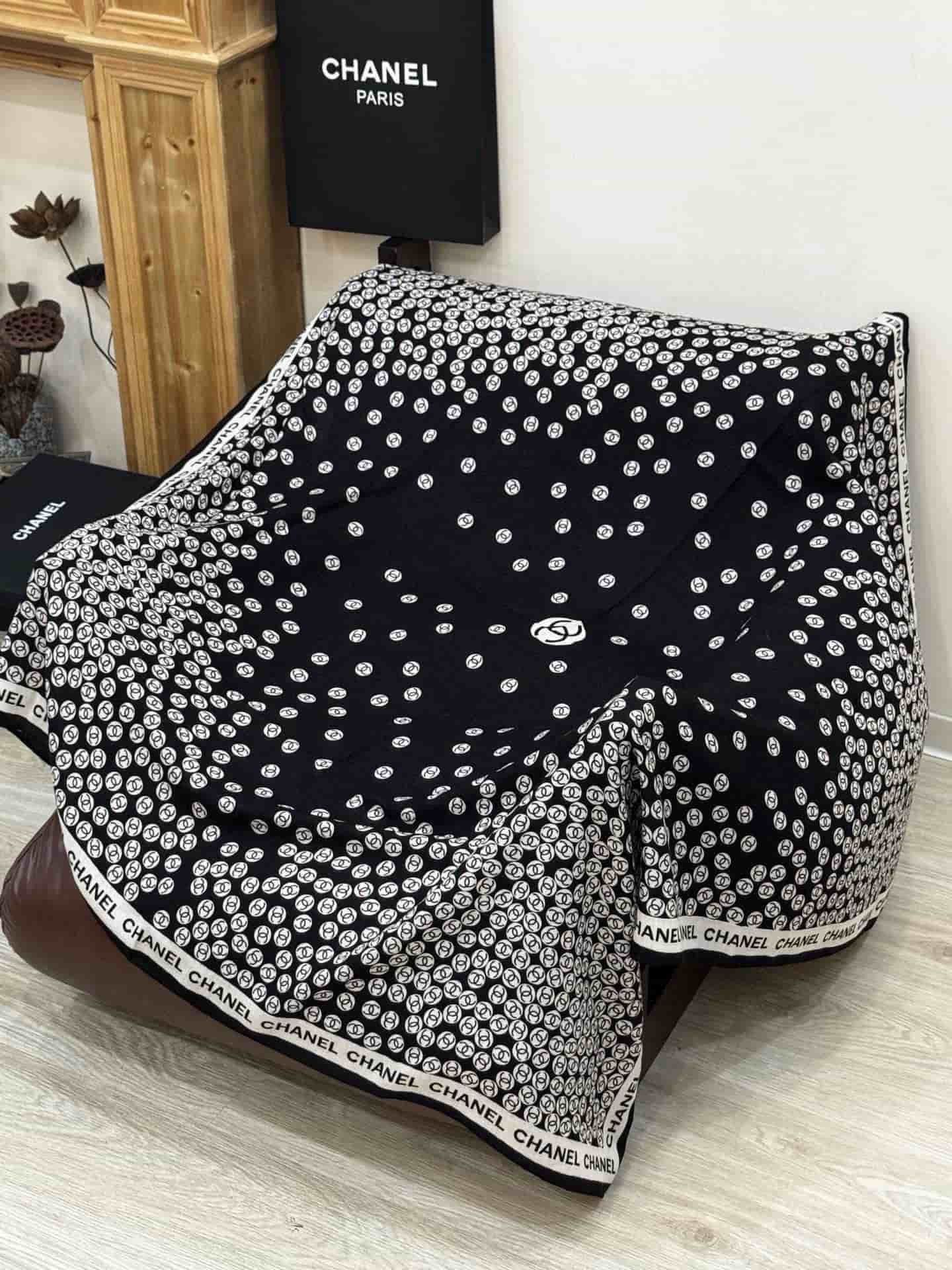 Chanel silk scarf featuring polka dot pattern