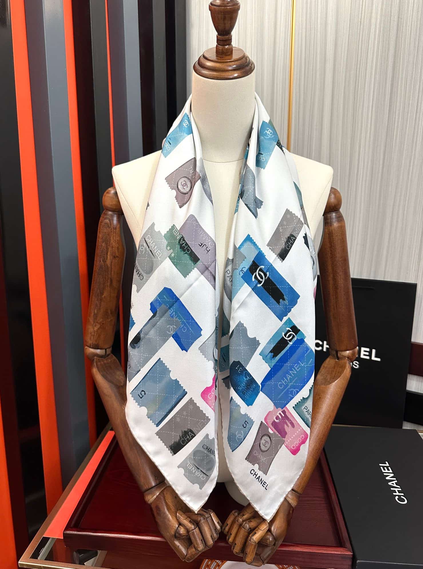 Chanel silk scarf featuring blue and pink stamp print