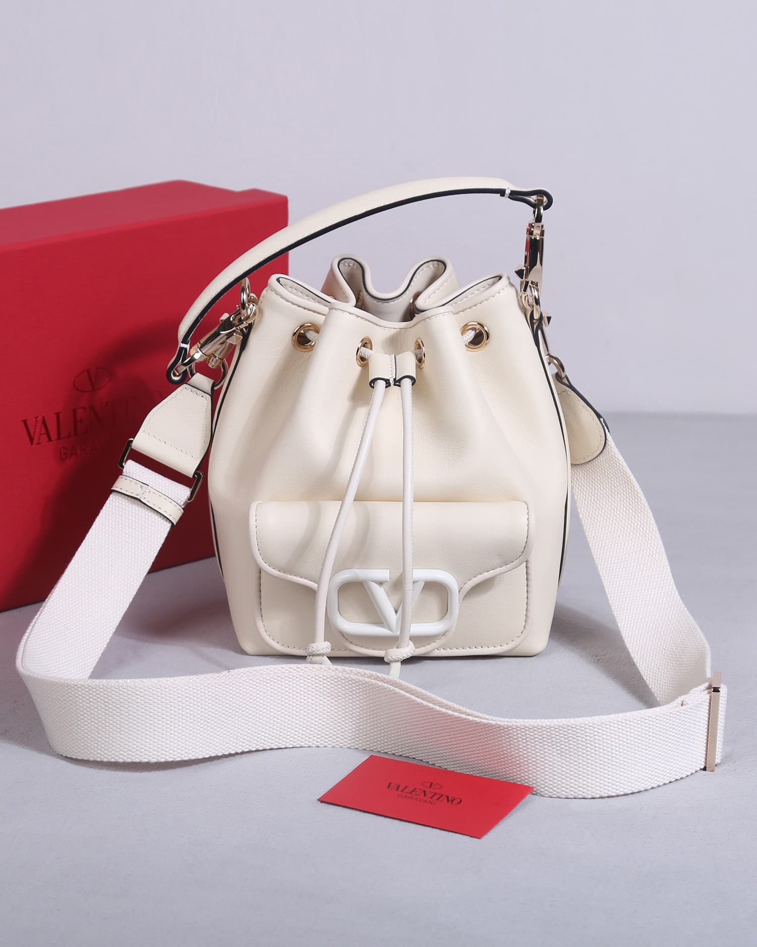 Valentino Garavani Locò calfskin leather bucket bag in white 22058 High