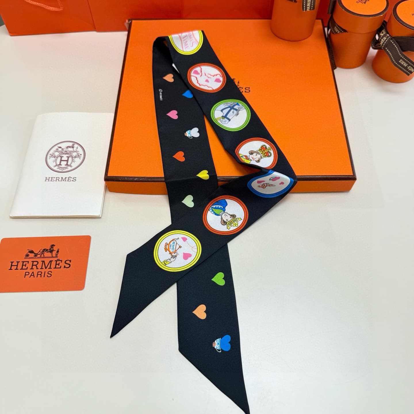 Hermes Twilly scarf featuring the 'Tea Time' motif