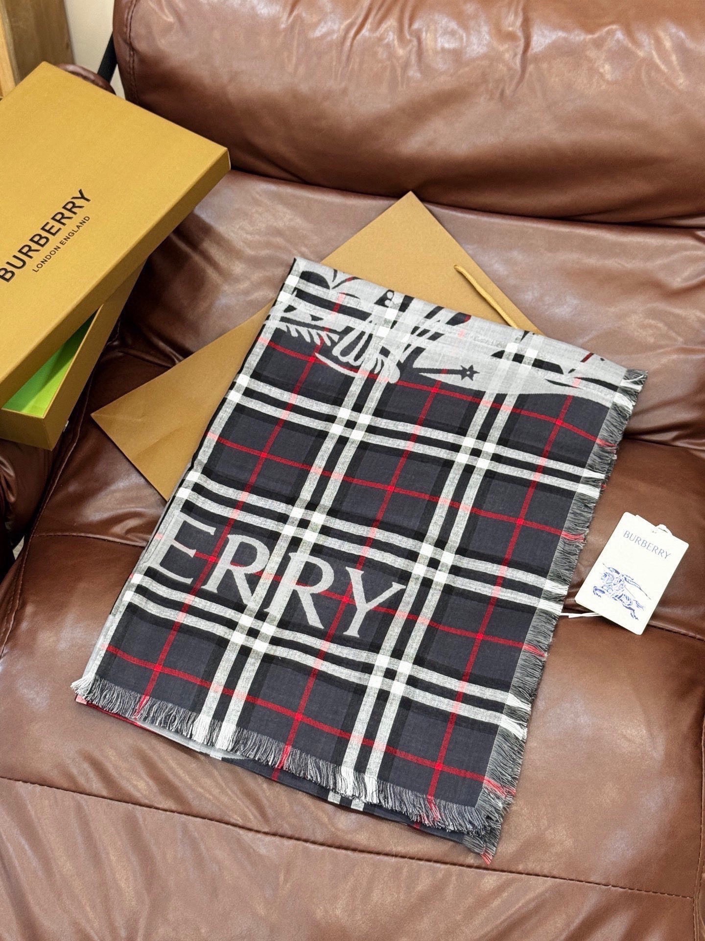 Burberry scarf featuring  check pattern and equestrian knight motif
