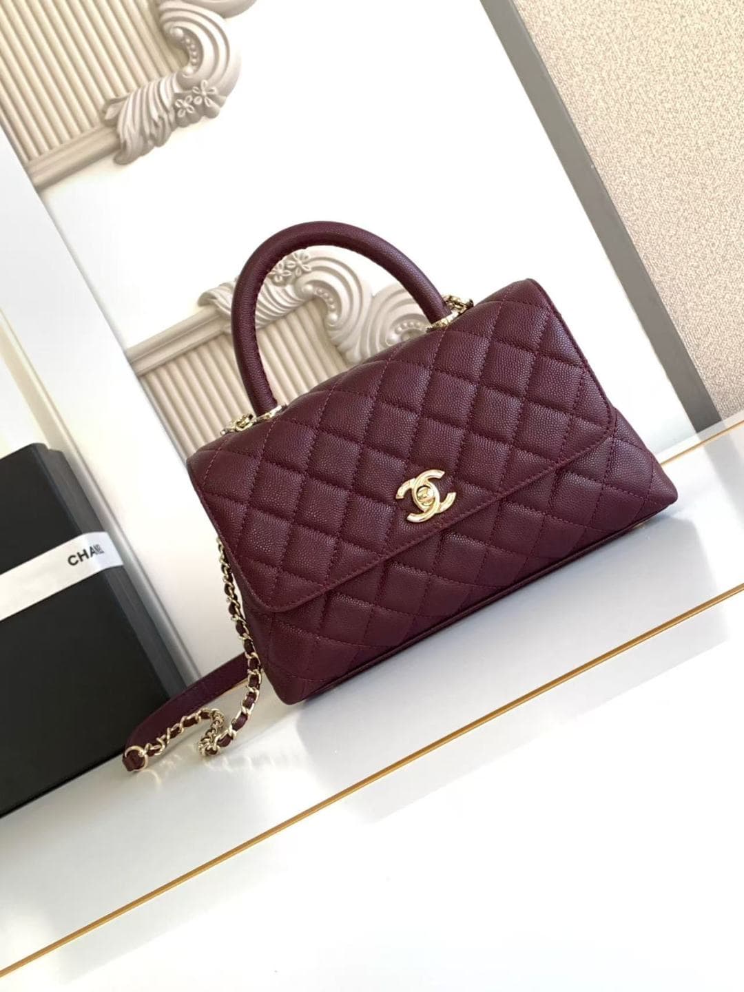 FLAP BAG WITH TOP HANDLE Grained Calfskin & Gold-Tone Metal A92990 Burgundy Binding A