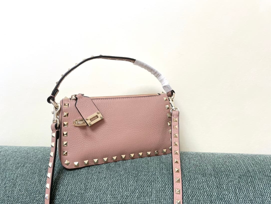 Valentino Garavani Mini Rockstud crossbody bag in powder pink Grained Calfskin High