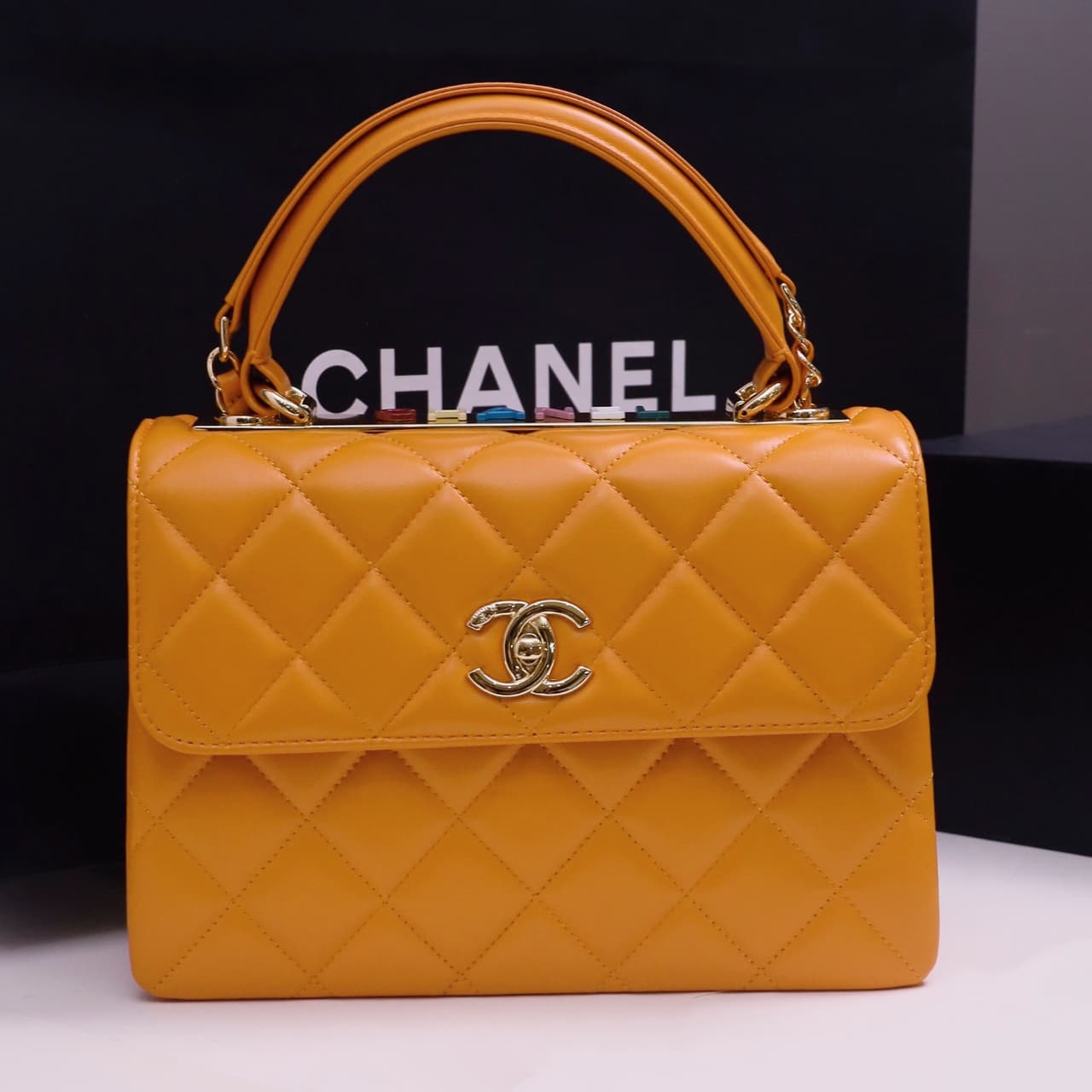 SMALL FLAP BAG WITH TOP HANDLE Lambskin Gold Metal Orange A