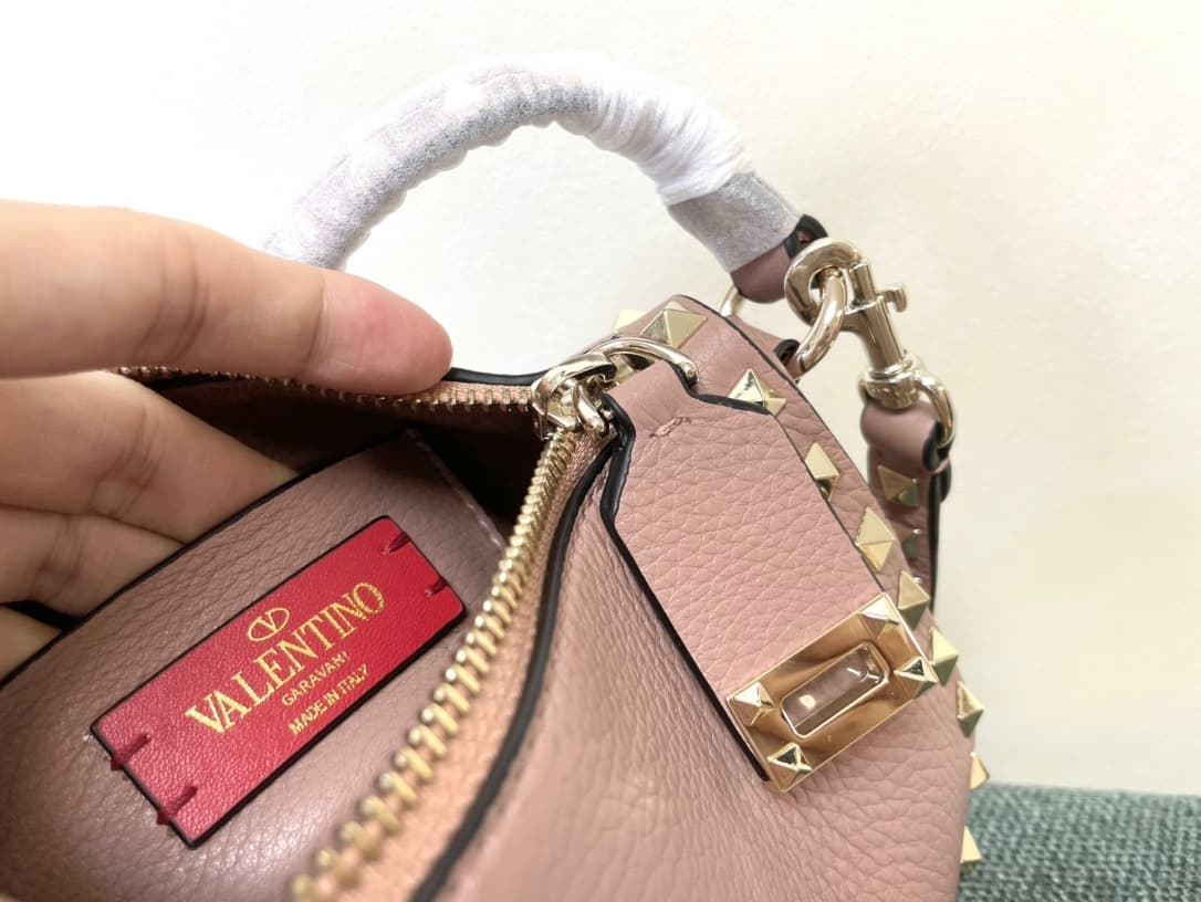 Valentino Garavani Mini Rockstud crossbody bag in powder pink Grained Calfskin High