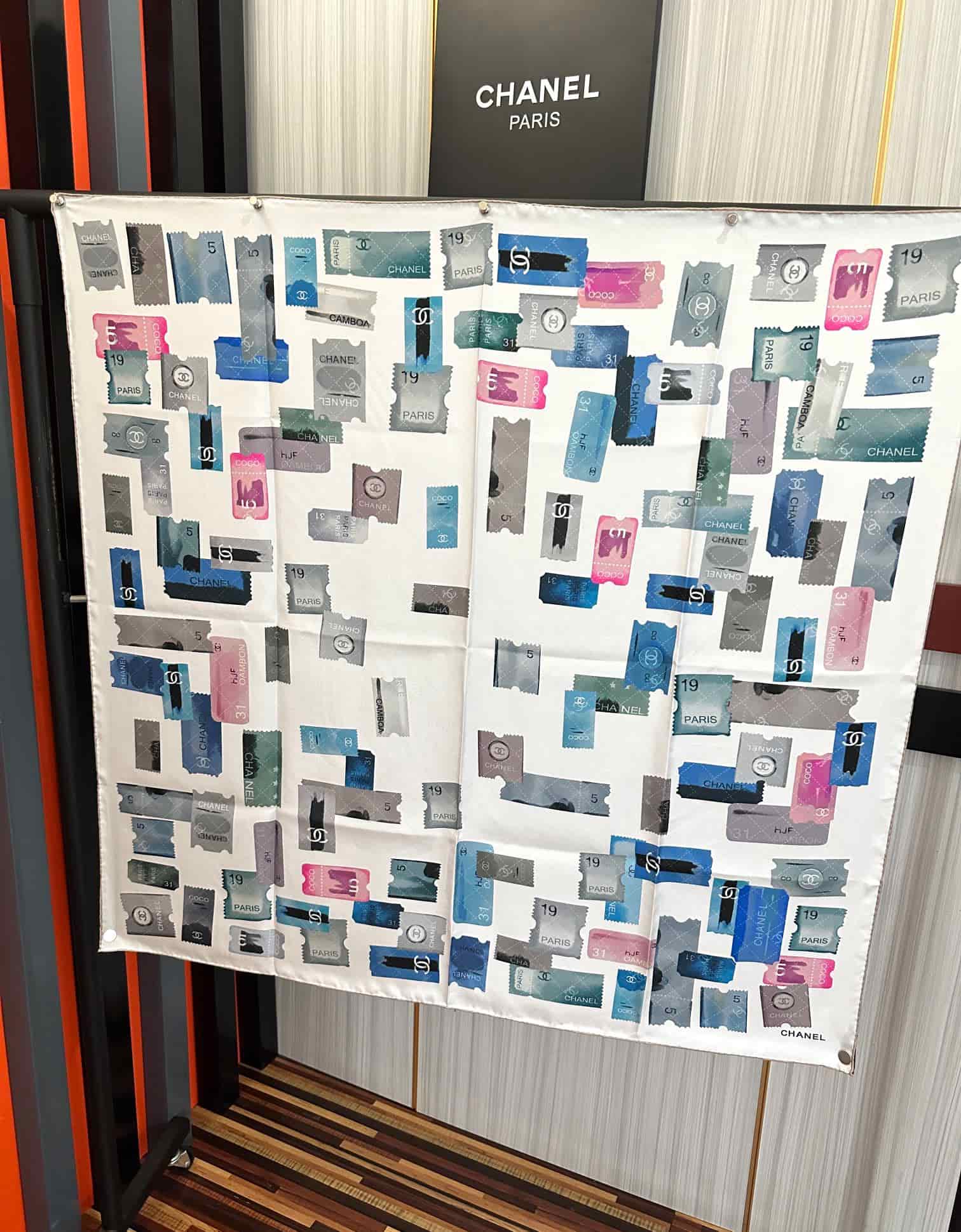 Chanel silk scarf featuring blue and pink stamp print