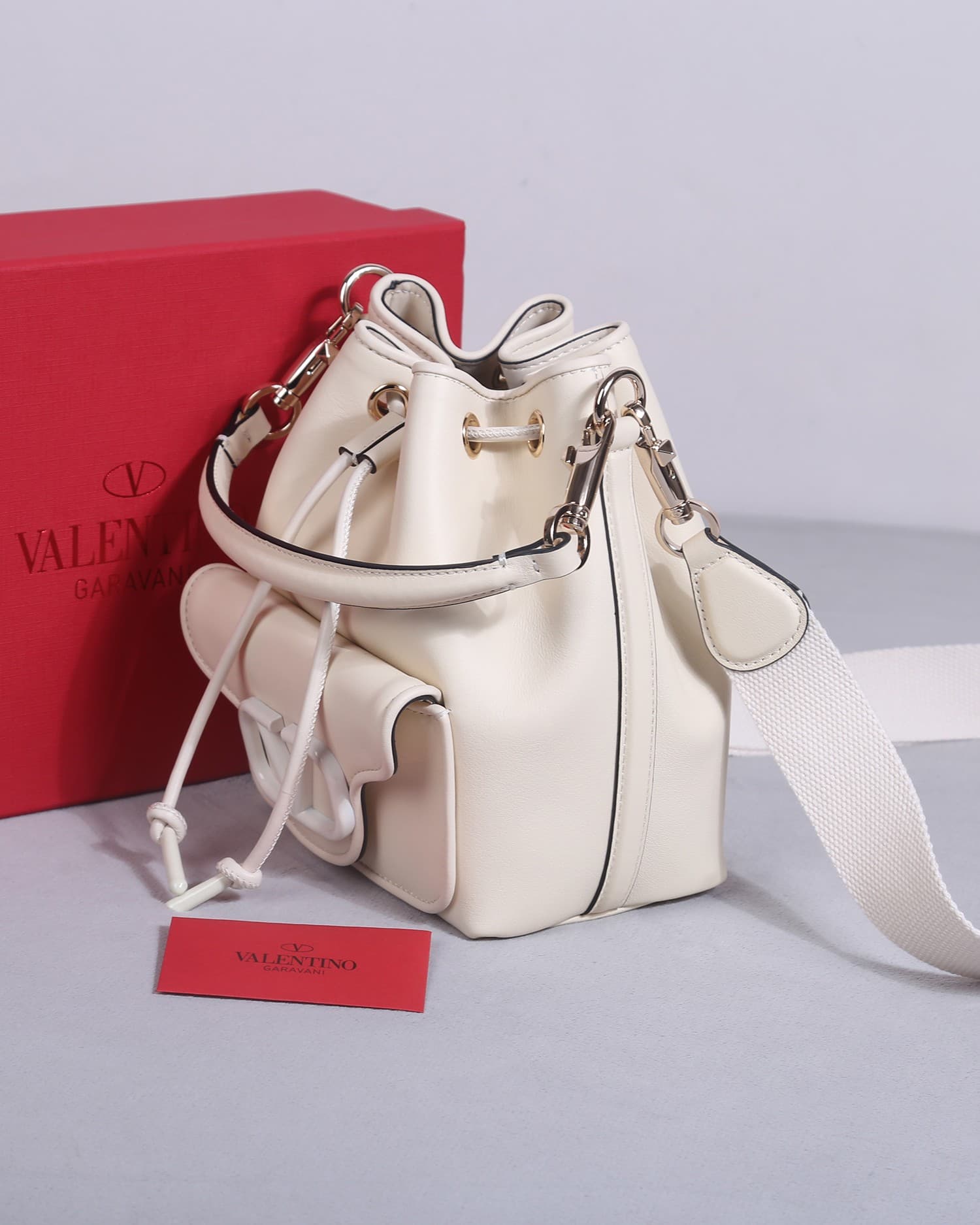 Valentino Garavani Locò calfskin leather bucket bag in white 22058 High