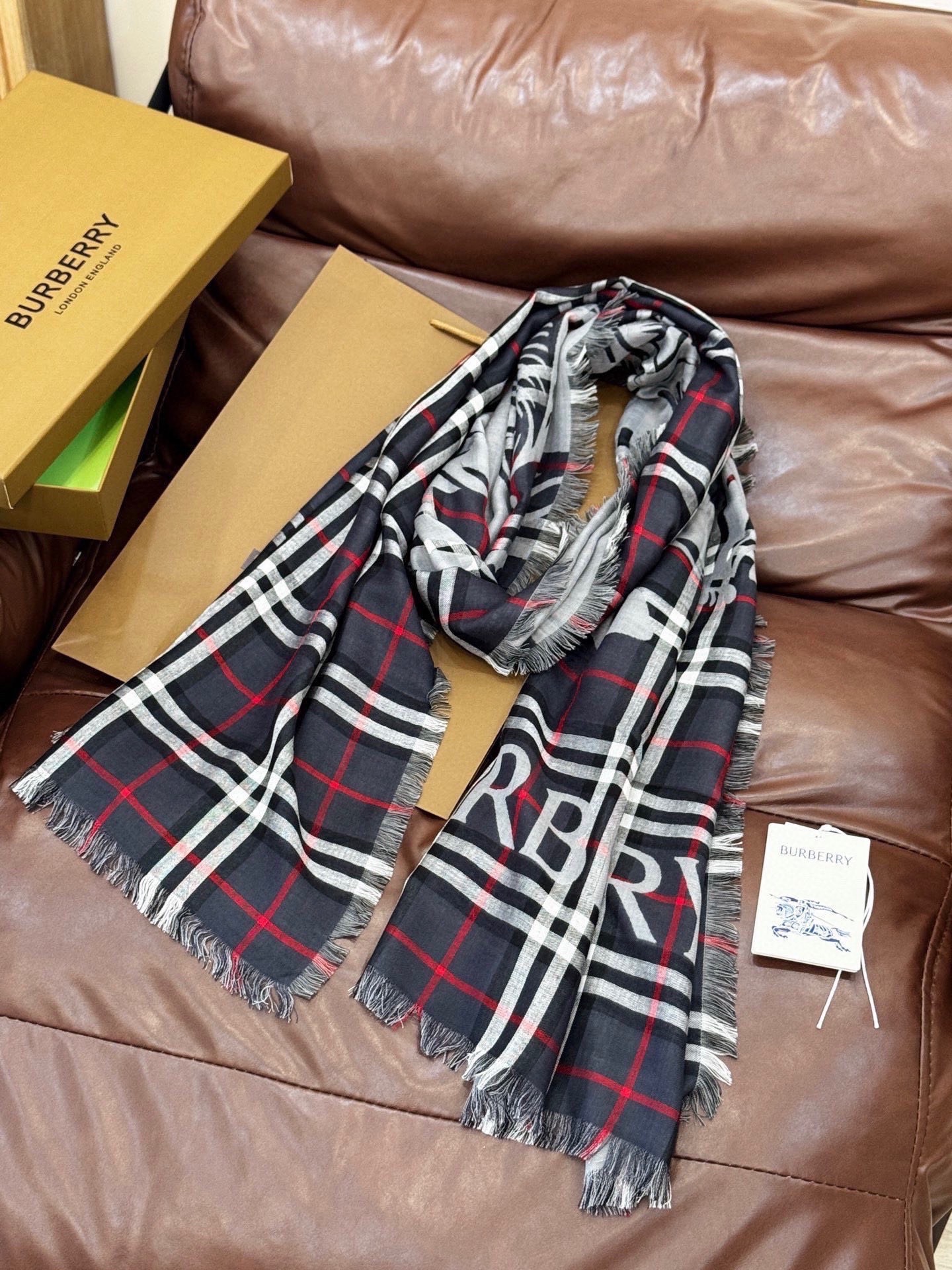 Burberry scarf featuring  check pattern and equestrian knight motif