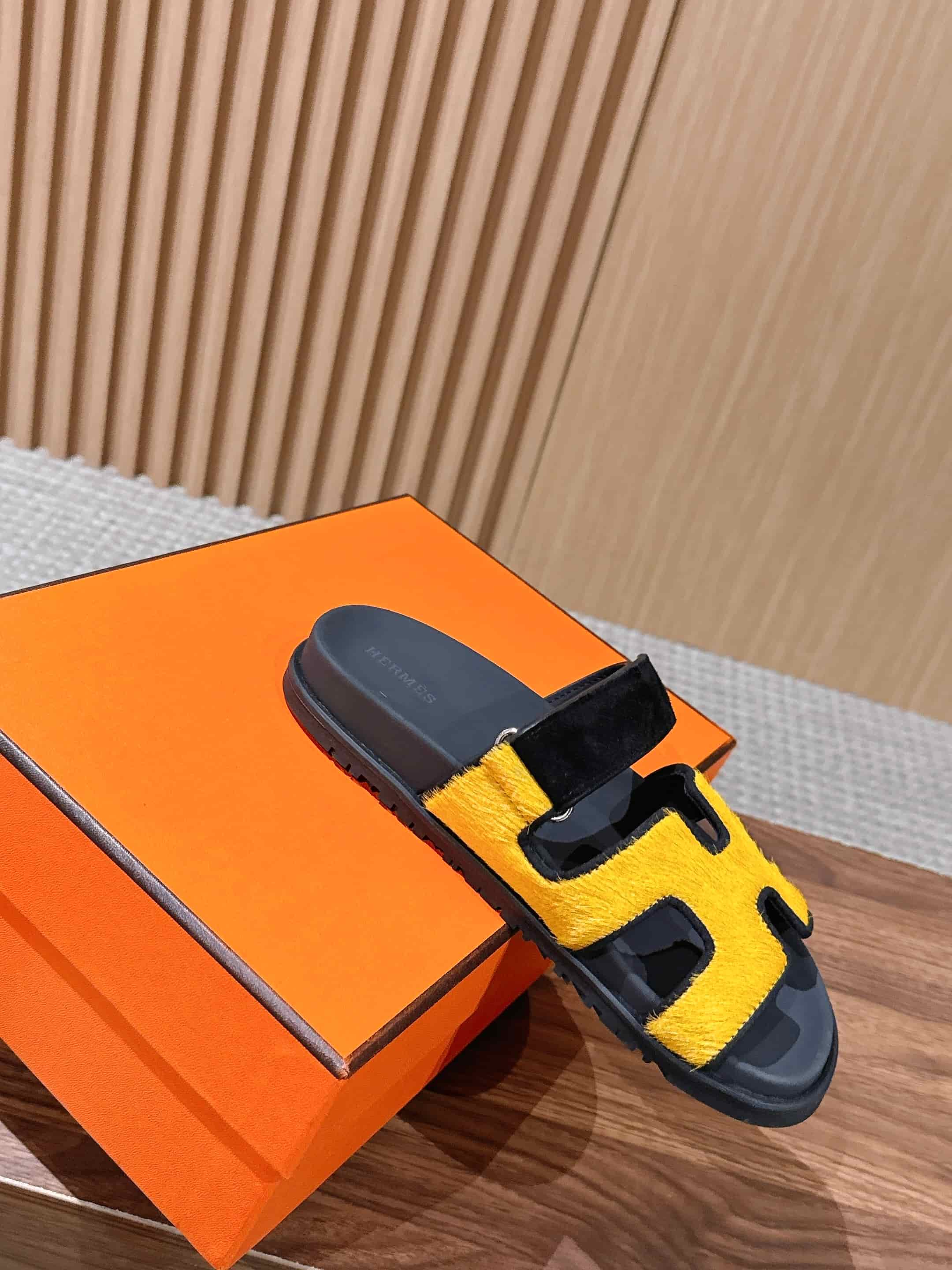 Hermès Chypre sandals in yellow suede with black accents Women Men