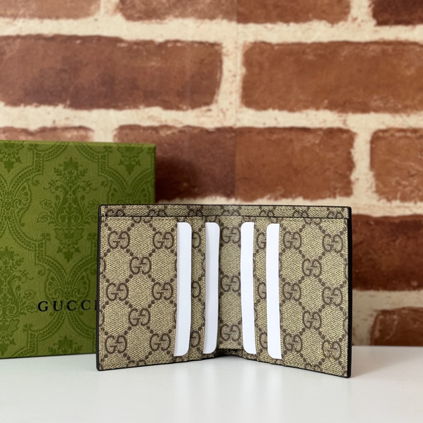 GG Emblem bi-fold wallet with GG fabric Brown smooth leather 818949  High
